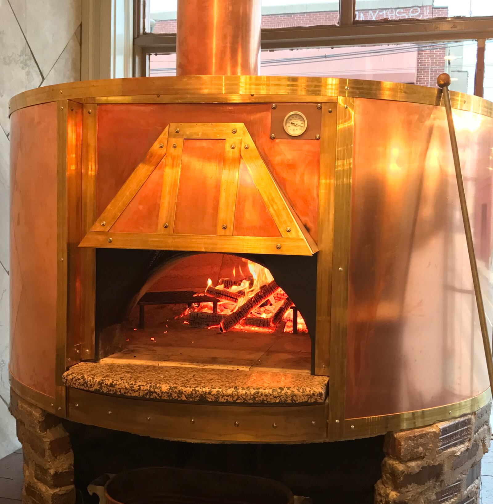 The wood-fired oven inside District Provisions at 521 Wayne Ave. in Dayton. CONTRIBUTED