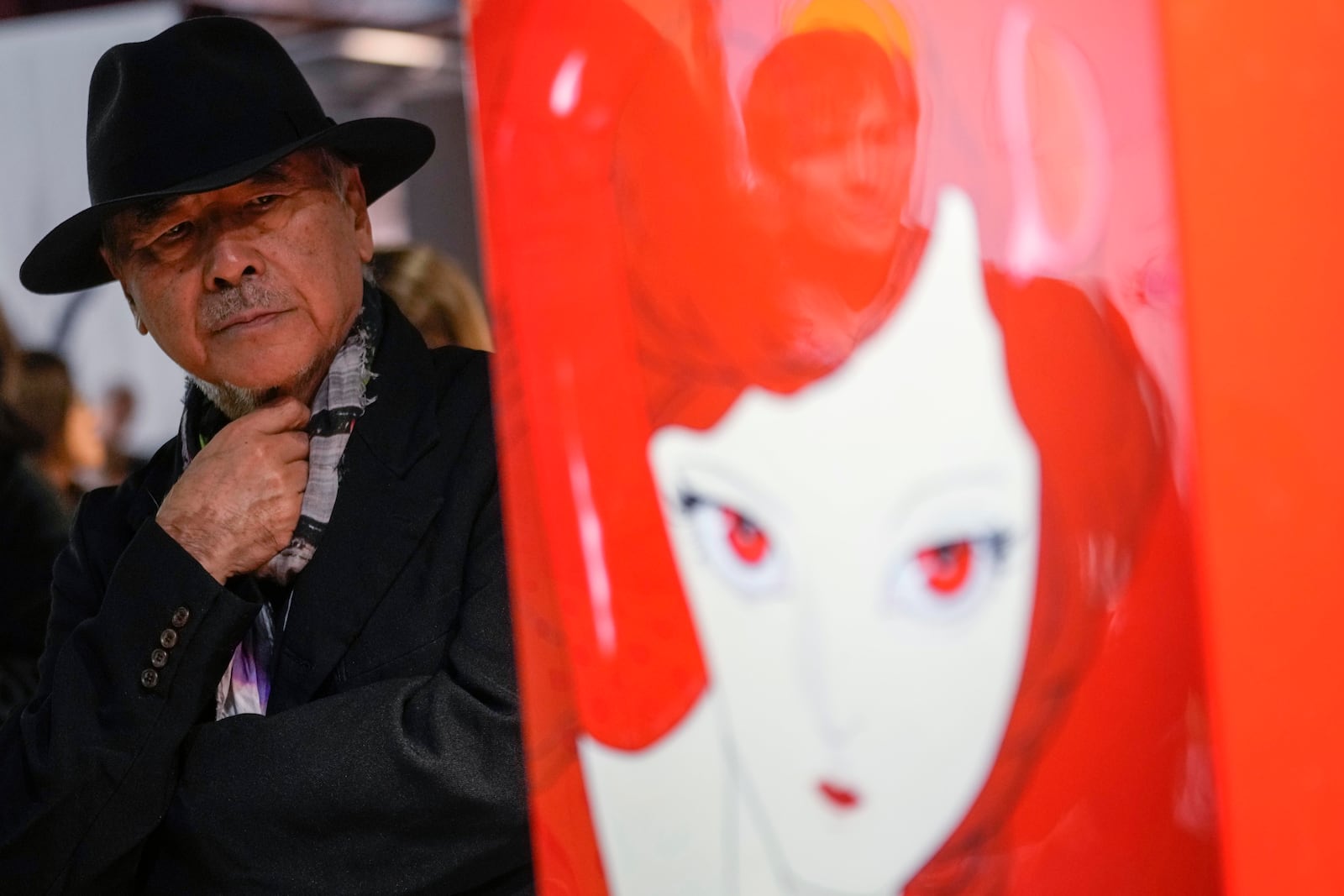 Artist Yoshitaka Amano attends the press preview of the exhibition "Amano Corpus Animae", celebrating his 50-year-long career, at the Fabbrica del Vapore, in Milan, Italy, Tuesday, Nov. 12, 2024. (AP Photo/Luca Bruno)