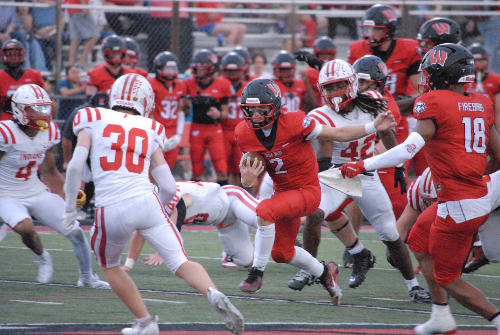 Lakota West's Sam Wiles (2) looks for running room against Fairfield on Friday night. Chris Vogt/CONTRIBUTED