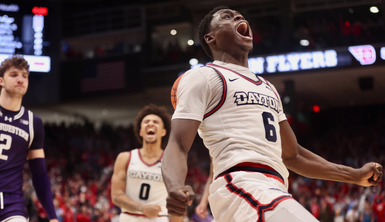 Dayton's Enoch Cheeks celebrates after a dunk in the second half against Northwestern on Saturday, Nov. 9, 2024, at UD Arena. David Jablonski/Staff