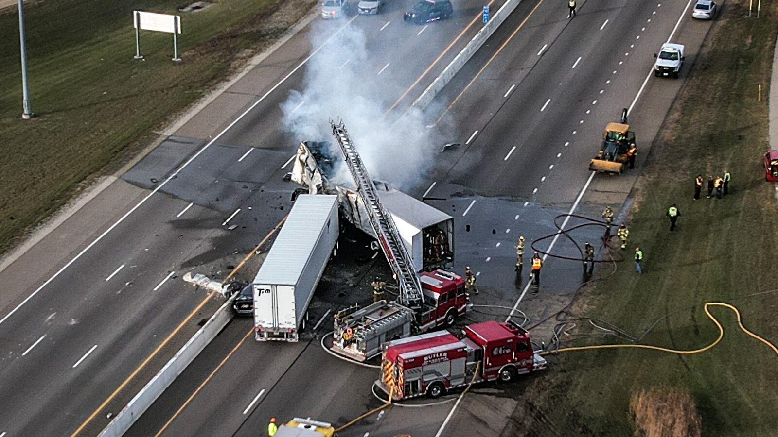 A Blanchester woman died at the scene of a fiery crash involving two semis, an SUV and two cars that shut down both directions of Interstate 75 near I-70 on Friday afternoon, Dec. 2, 2022. JIM NOELKER/STAFF