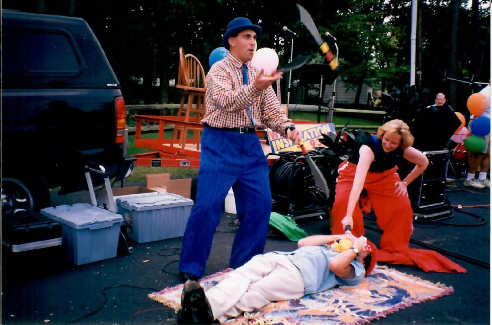 Derrick Dye juggles daggers over Bill Nance at an outdoor "Kaleidoscope." CONTRIBUTED