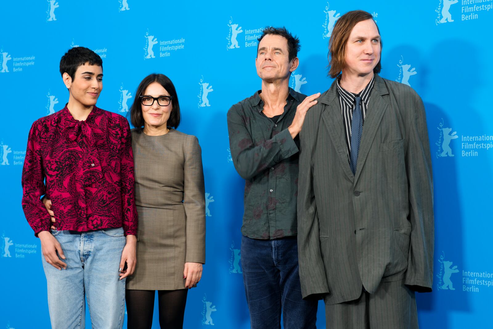 From left: Tala Al-Deen, Nicolette Krebitz, director Tom Tykwer and Lars Eidinger pose for photographers at the photo call for the film 'Das Licht' at the International Film Festival, Berlinale, in Berlin, Thursday, Feb. 13, 2025. (AP Photo/Markus Schreiber)