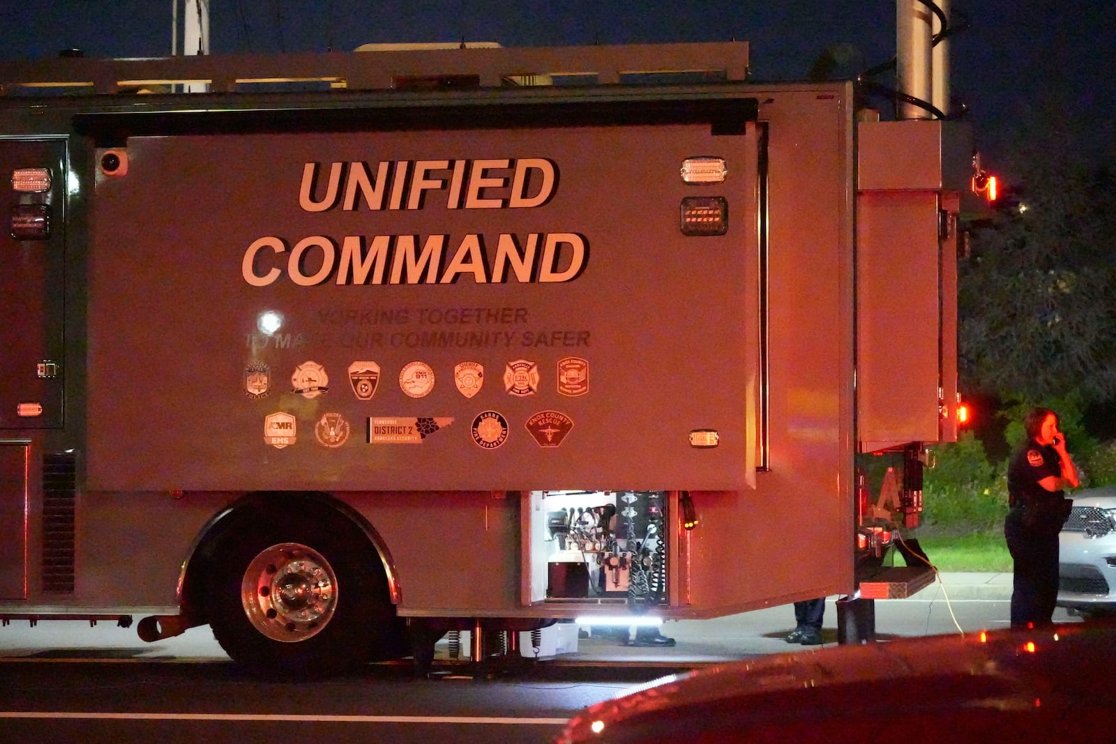 Knoxville Police and Knoxville Fire's Command center respond to the discovery of suspicious container at CMC Recycling in Knoxville. Tenn., Thursday, Oct. 10, ,2024. (Saul Young/Knoxville News Sentinel via AP)