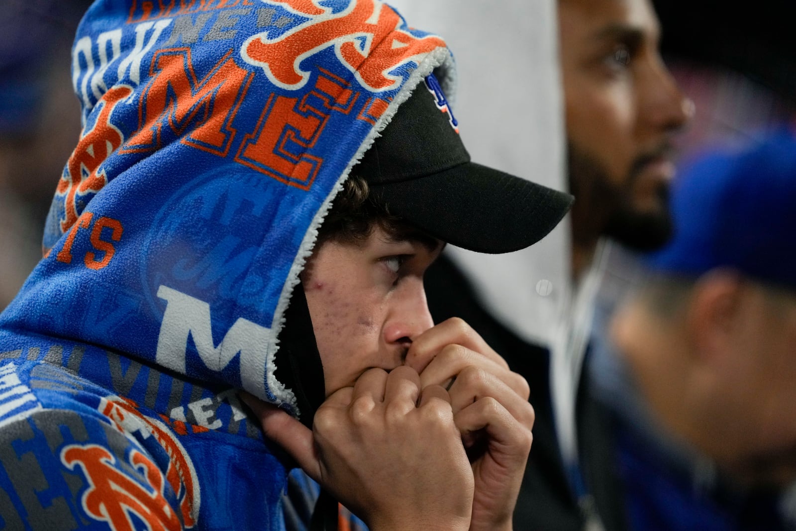 A New York Mets fan watches during their loss against the Los Angeles Dodgers in Game 4 of a baseball NL Championship Series, Thursday, Oct. 17, 2024, in New York. (AP Photo/Ashley Landis)