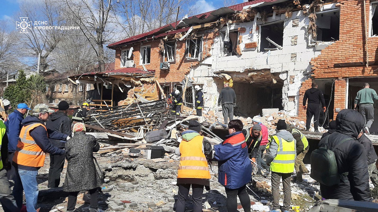 In this photo provided by the Ukrainian Emergency Service, residents clear the rubbles following a Russian drone attack in Kropyvnytskyi, Kirovohrad region, Ukraine, Thursday, March 20, 2025. (Ukrainian Emergency Service via AP)