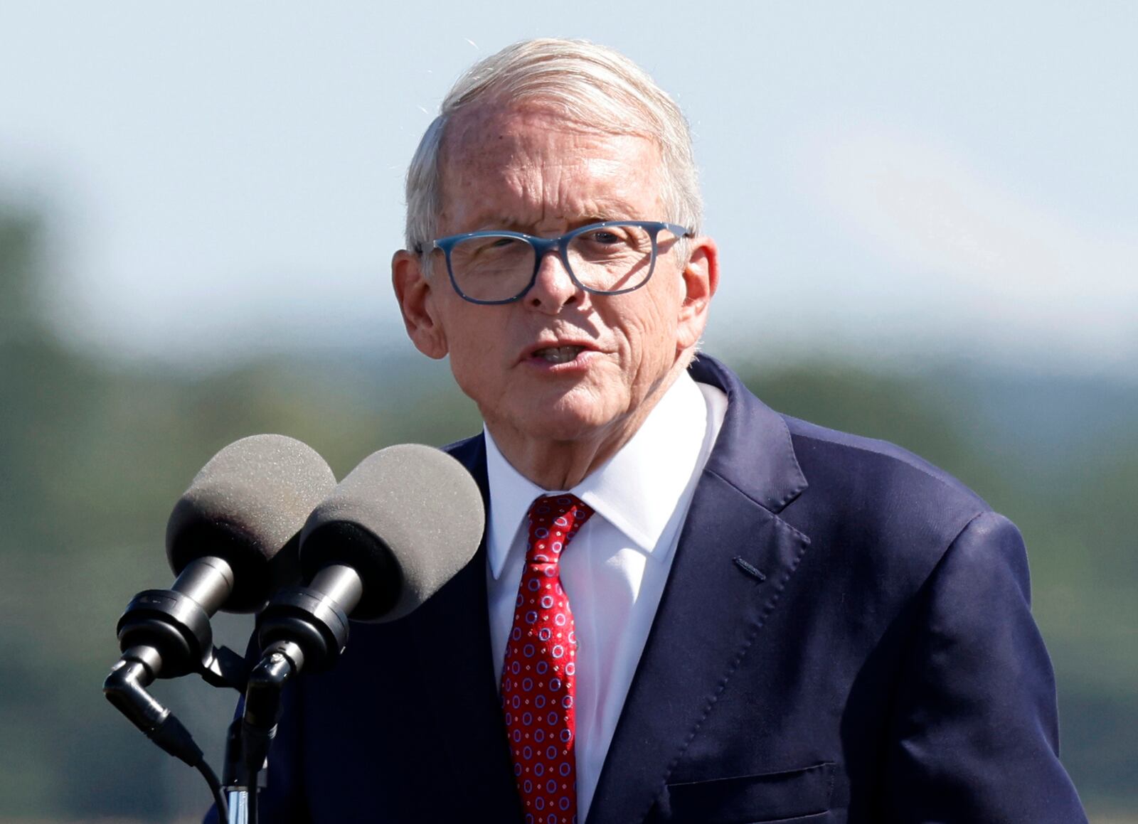 FILE— In this file photo from Sept. 9, 2022 Ohio Gov. Mike DeWine speaks during the groundbreaking ceremony for the new Intel semiconductor manufacturing facility in New Albany, Ohio. The Ohio Debate Commission said Wednesday, Sept. 21, 2022, that neither Republican Gov. DeWine nor Senate nominee JD Vance accepted their invitations that were extended in May by the 5 p.m. Tuesday deadline. (AP Photo/Paul Vernon, File)