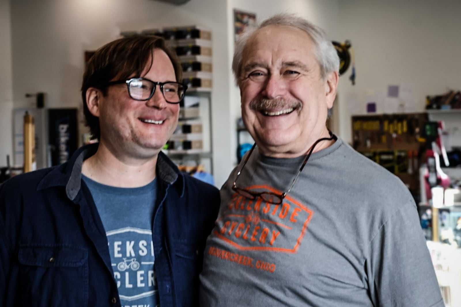 Conrad Dillon left, and his father Mike Dillon are co-owners of Creekside Cyclery and are moving to a new location on Grange Hall Road in Beavercreek. JIM NOELKER/STAFF