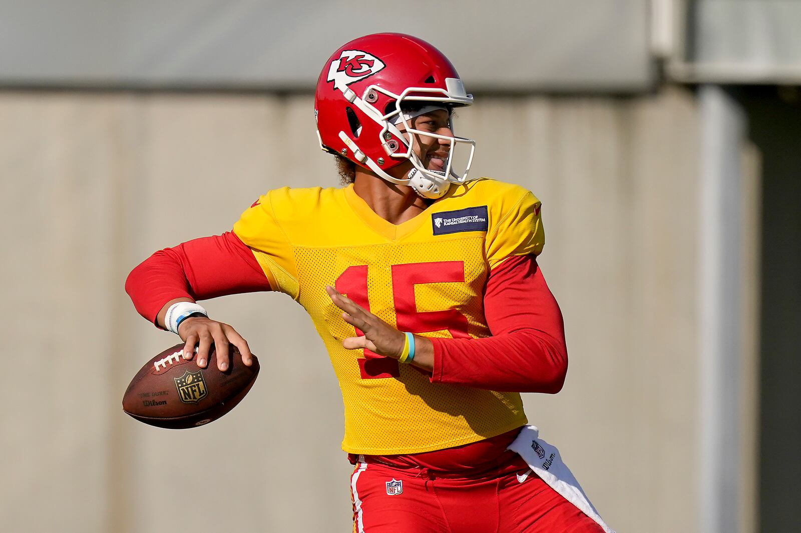 FILE - Kansas City Chiefs quarterback Patrick Mahomes throws a pass during NFL football training camp Friday, Aug. 21, 2020, in Kansas City, Mo. It has been a mere eight months since Patrick Mahomes led Kansas City from a 24-0 hole to beat Deshaun Watson and the Houston Texans in the divisional round of the playoffs, a brutally efficient comeback that ultimately propelled the Chiefs to their first Super Bowl title in 50 years. A whole lot has changed, though. (AP Photo/Charlie Riedel, File)