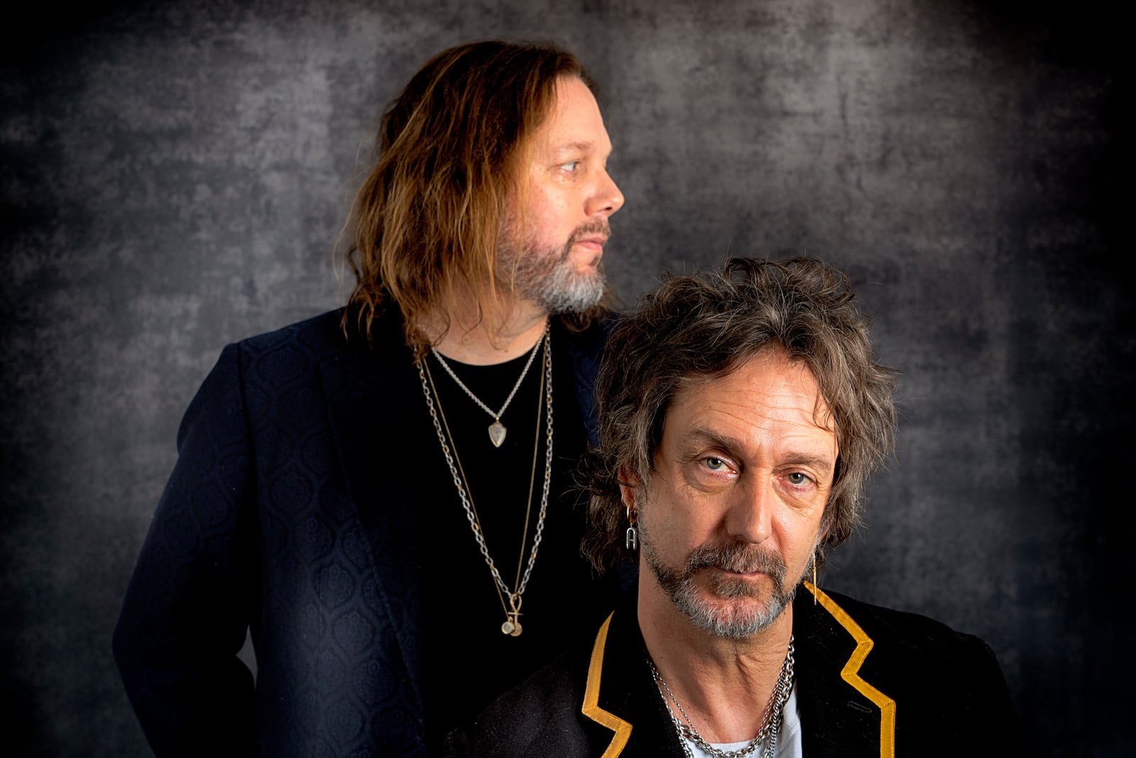 Rich Robinson, left, and his brother Chris Robinson of The Black Crowes pose for a portrait in Los Angeles on Monday, Dec. 9, 2024. (AP Photo/Richard Vogel)