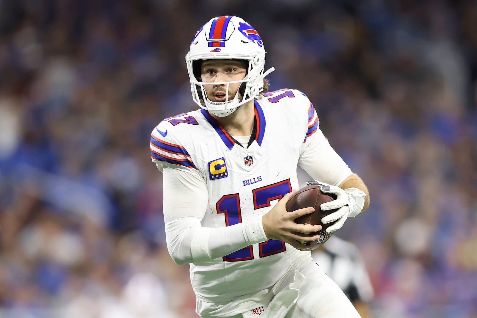 Buffalo Bills quarterback Josh Allen (17) runs against the Detroit Lions during the second half of an NFL football game, Sunday, Dec. 15, 2024, in Detroit. (AP Photo/Rey Del Rio)