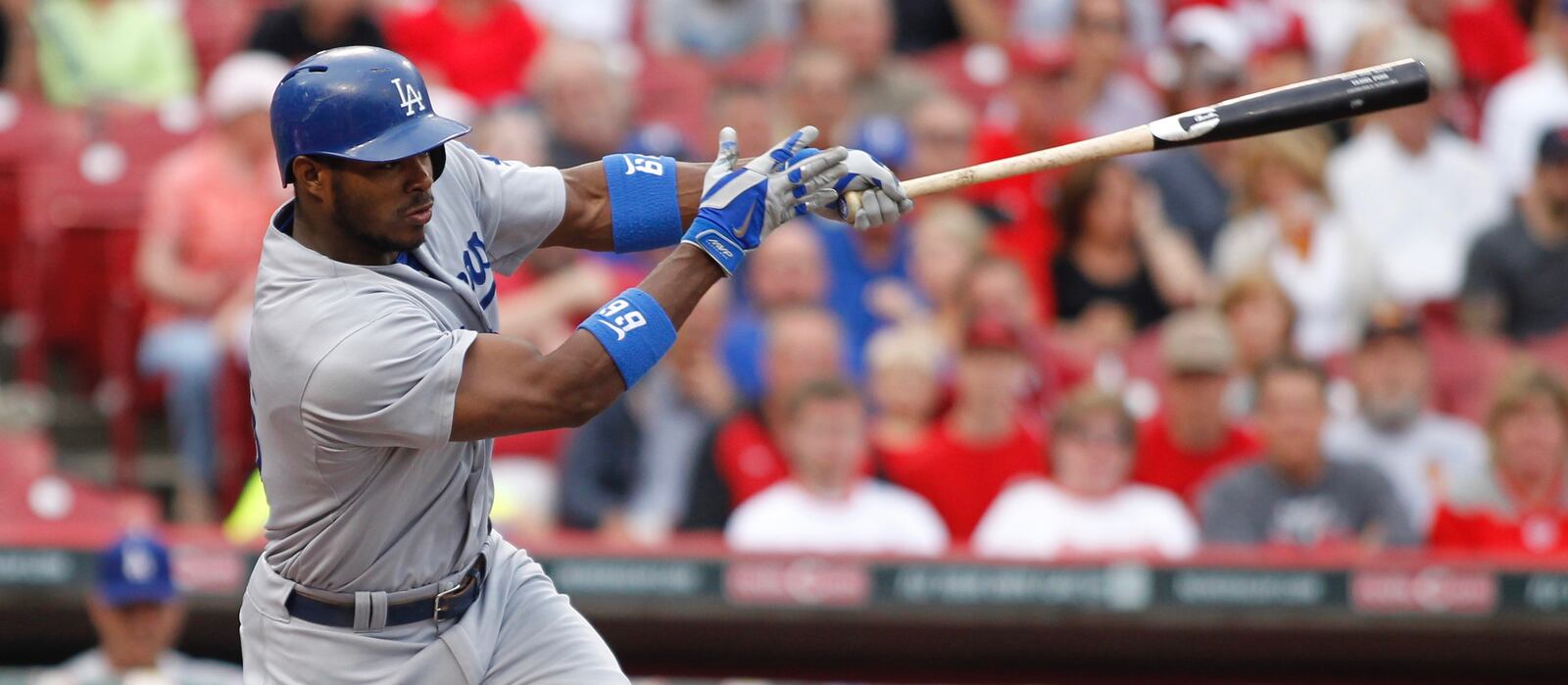 The Dodgers’ Yasiel Puig singles in the first inning on Monday, June 9, 2014, at Great American Ball Park in Cincinnati. David Jablonski/Staff