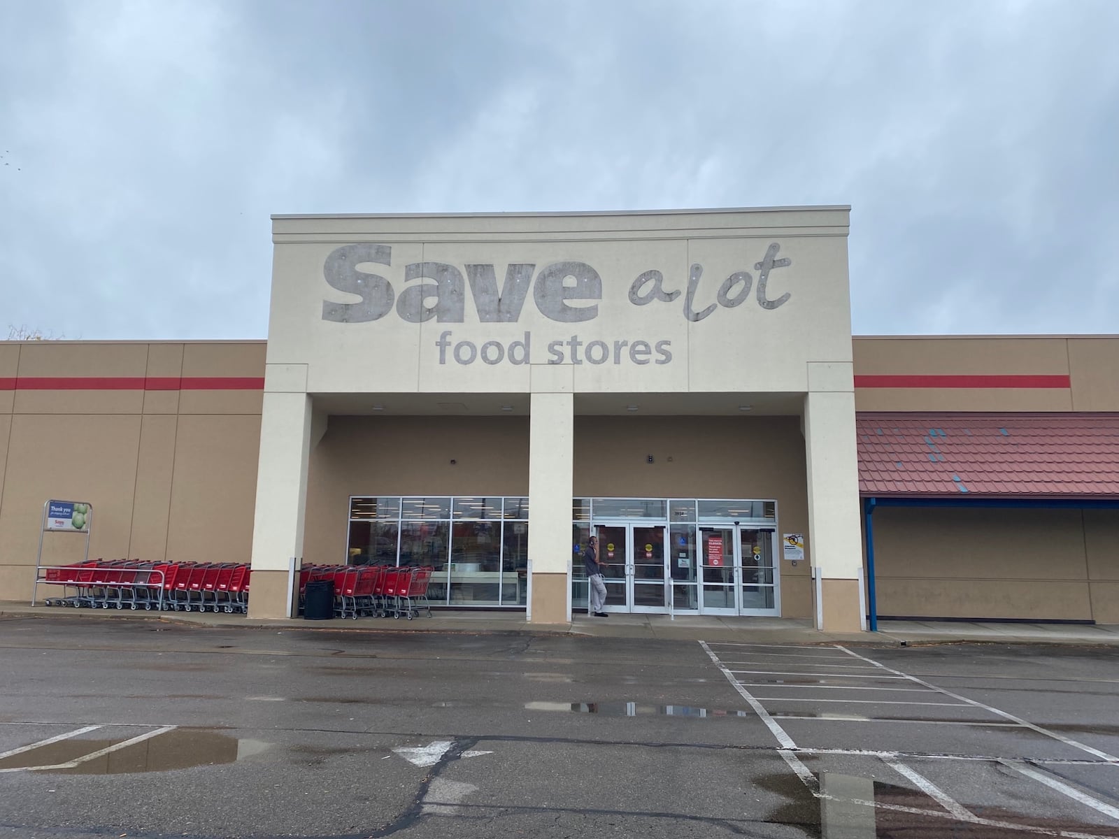 A sign posted outside of the Save A Lot on Linden Avenue says the store is closed. Eileen McClory / Dayton Daily News