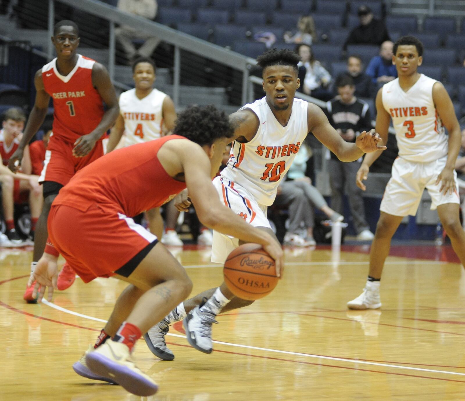 Da’Juan Allen of Stivers (right) gets defensive. Stivers defeated Cin. Deer Park 76-62 in a boys high school basketball D-III district final at UD Arena on Sunday, March 10, 2019. MARC PENDLETON / STAFF