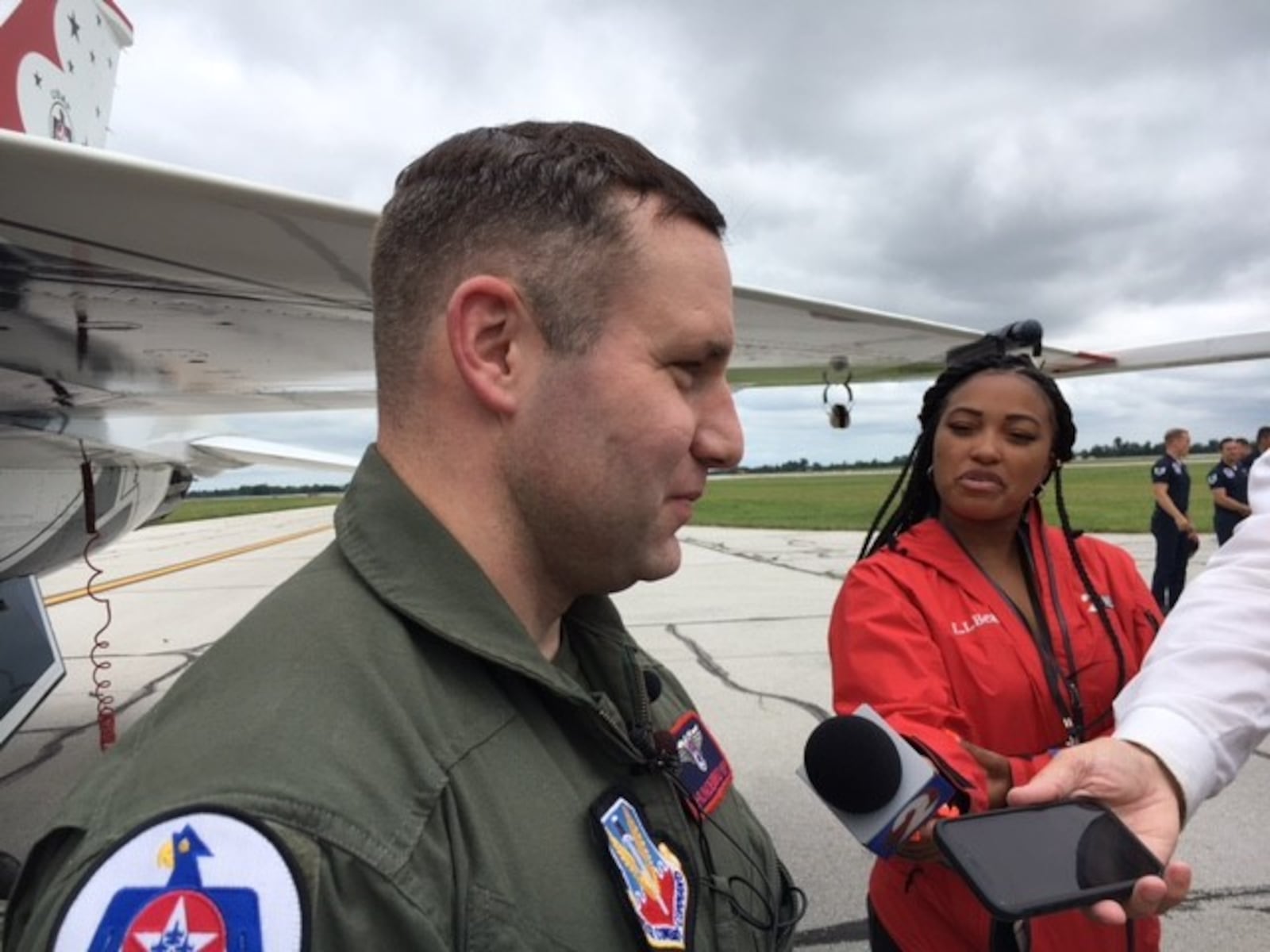 Dayton police officer Ryan Nabel after his "hometown heroes" ride with Air Force Thunderbirds pilot Maj. Jason Markzon Friday. THOMAS GNAU/STAFF