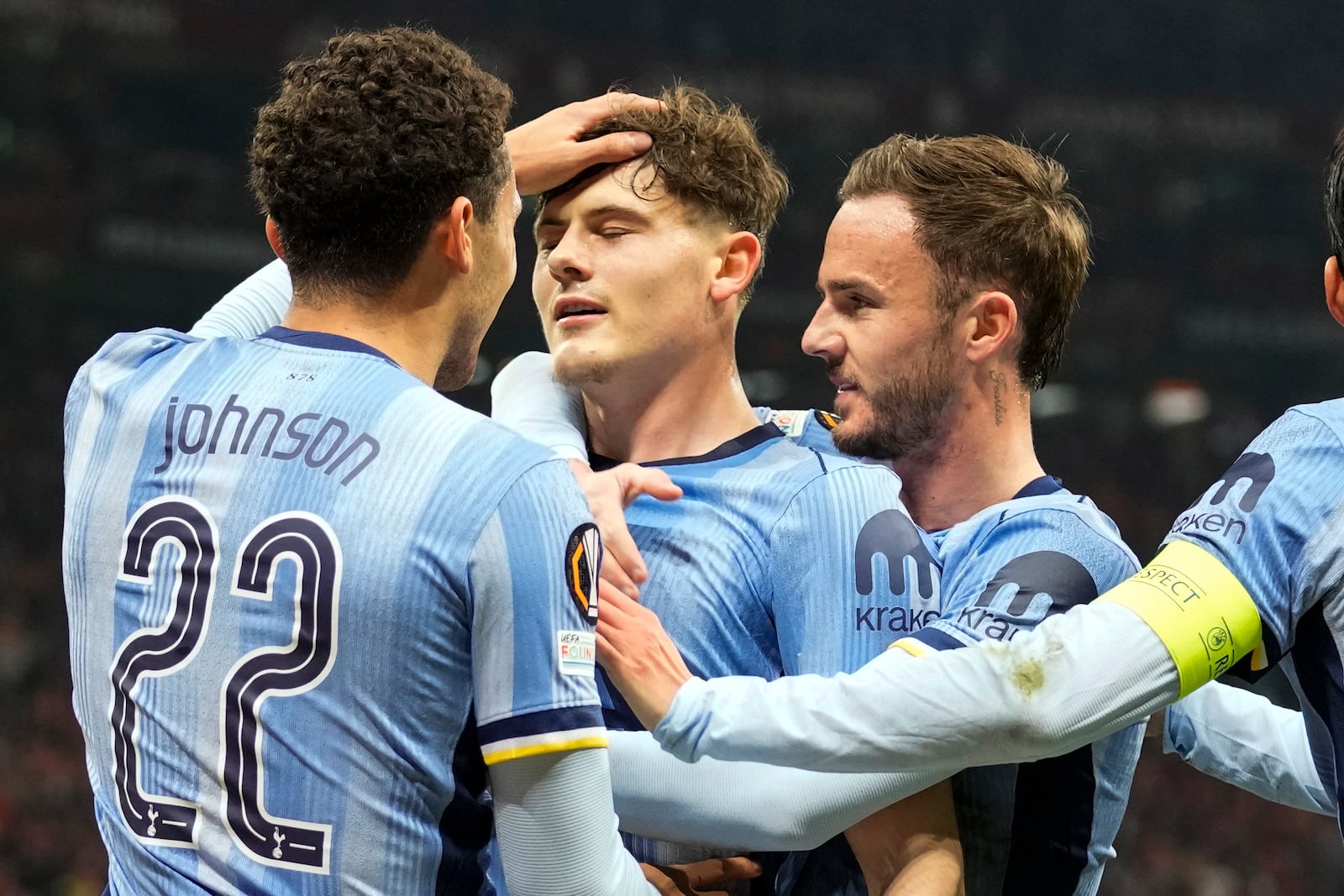 Tottenham's Will Lankshear, center, celebrates with his teammates after scoring his side's first goal during the Europa League opening phase soccer match between Galatasaray and Tottenham Hotspur at Ali Sami Yen stadium, in Istanbul, Turkey, Thursday, Nov. 7, 2024. (AP Photo/Khalil Hamra)