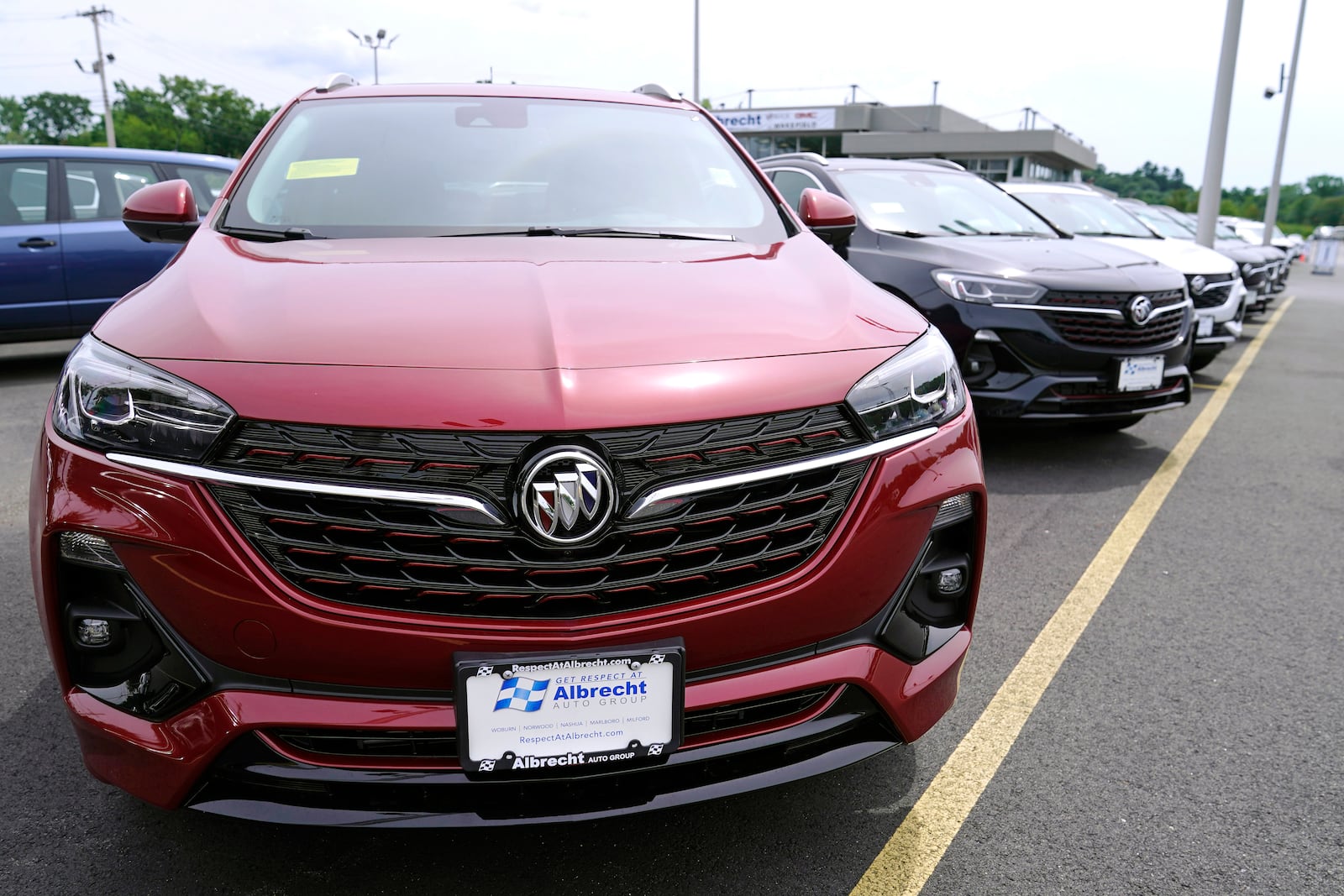 New Buick Encore SUV's displayed on the sales lot at the Albrecht Auto Group dealership, Tuesday, Aug. 3, 2021, in Wakefield, Mass. Prices for U.S. consumers rose in July at the slowest pace since February, a sign that Americans could gain some relief after four months of sharp increases that had elevated inflation to its fastest pace in more than a decade. Most economists agree that the primary drivers of higher prices have been categories of goods and services that were most disrupted by the pandemic, from new and used vehicles to hotel rooms, airline tickets and building materials. (AP Photo/Charles Krupa)