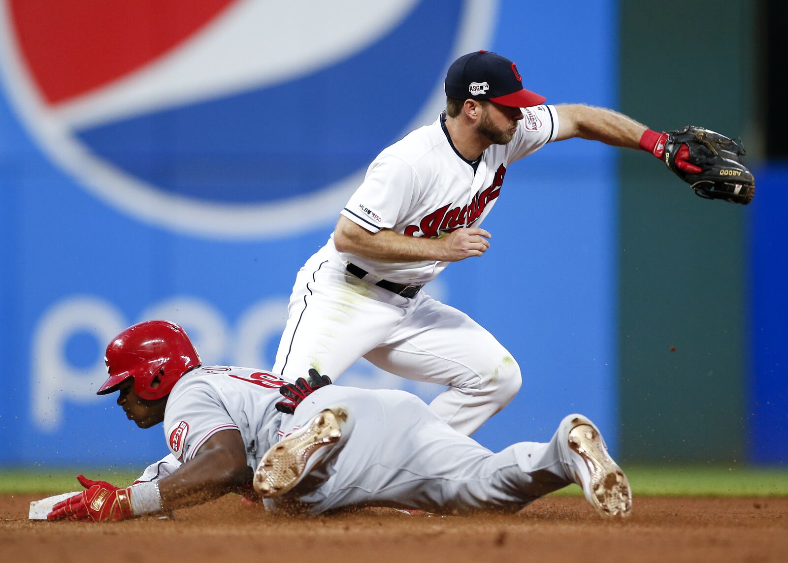 CLEVELAND, OH - JUNE 11: Yasiel Puig #66 of the Cincinnati Reds is safe at second base with a double as Mike Freeman #6 of the Cleveland Indians covers during the seventh inning at Progressive Field on June 11, 2019 in Cleveland, Ohio. (Photo by Ron Schwane/Getty Images)