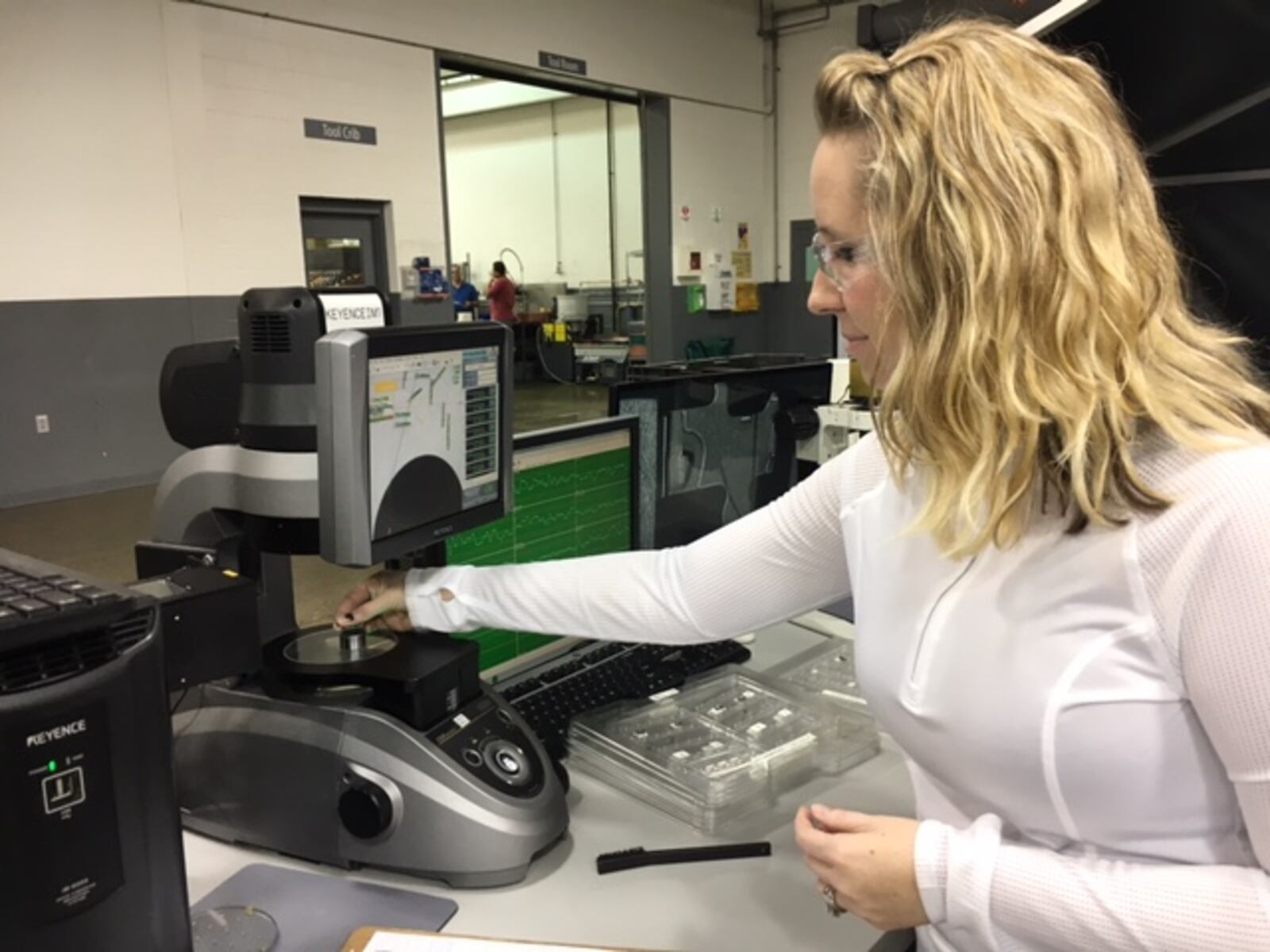 Veteran Norwood Medical employee Becca Hummer inspects parts in a March 2017 photograph. THOMAS GNAU/STAFF