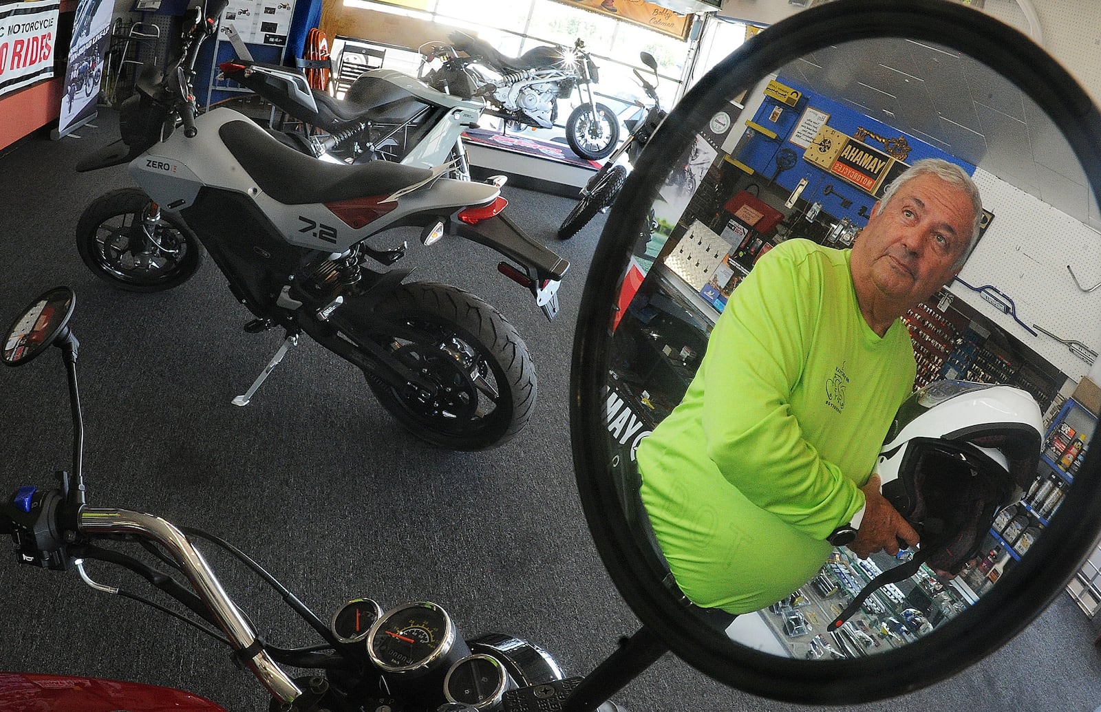 Fermin Heras, a local motorcycle instructor, stands Monday morning in Joe's Cycle Shop in Harrison Twp. He said it's important for both drivers and motorcyclists to pay attention while on the road. Heras said continuing education about motorcycle safety is also important for anyone who rides. MARSHALL GORBY \STAFF