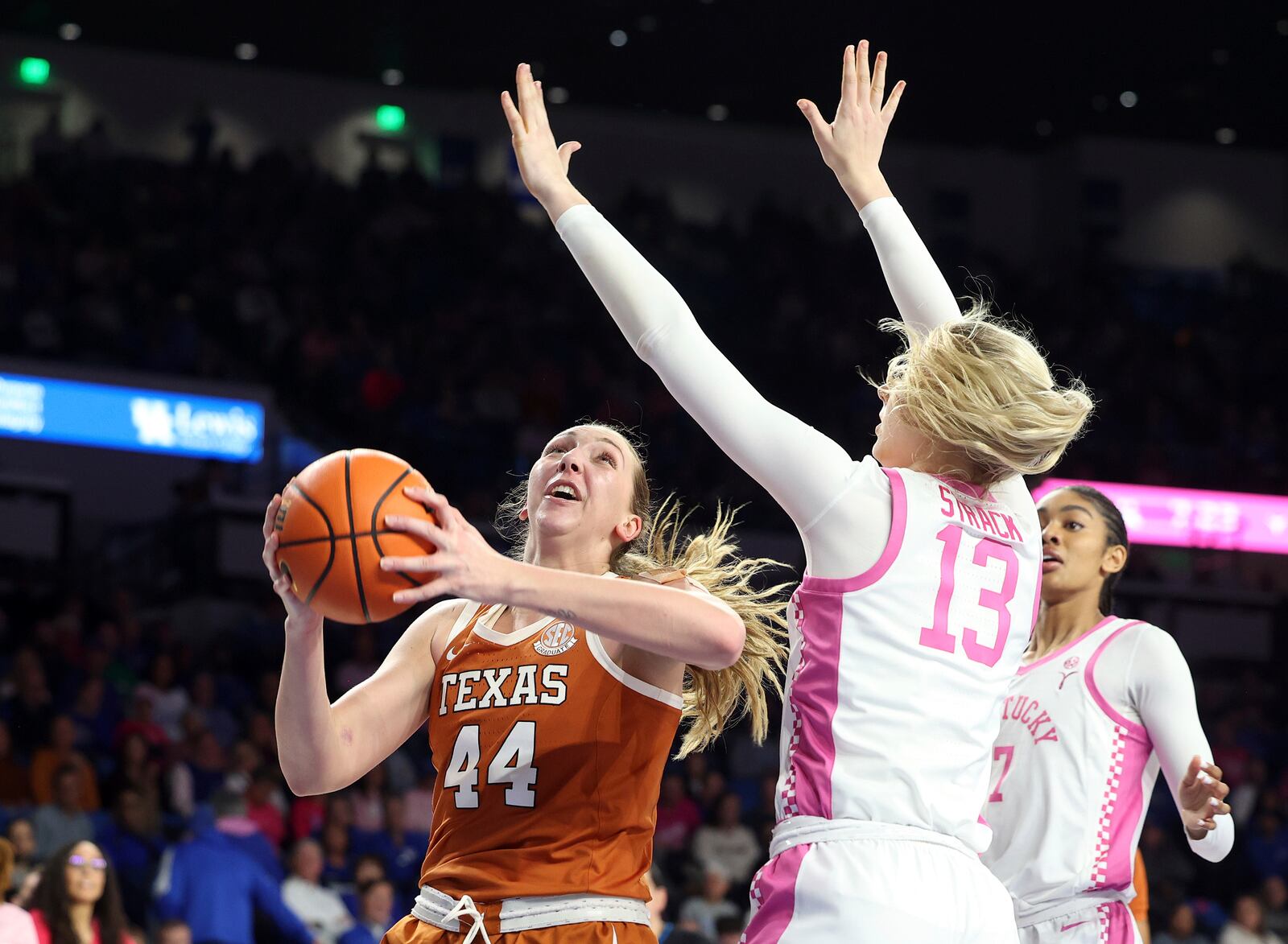 Texas' Taylor Jones (44) shoots while pressured by Kentucky's Clara Strack (13) during an NCAA college basketball game in Lexington, Ky., Thursday, Feb. 13, 2025. (AP Photo/James Crisp)