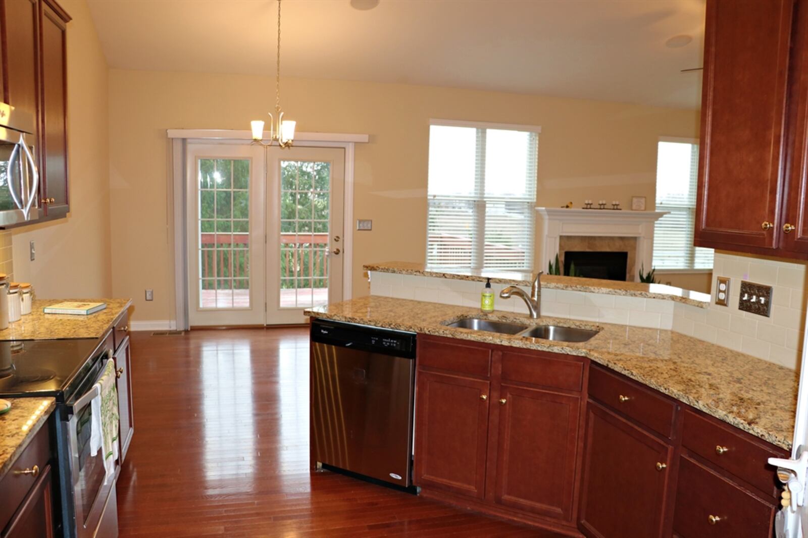 A wrap-around, dual-level peninsula counter divides the kitchen from the great room. CONTRIBUTED BY KATHY TYLER