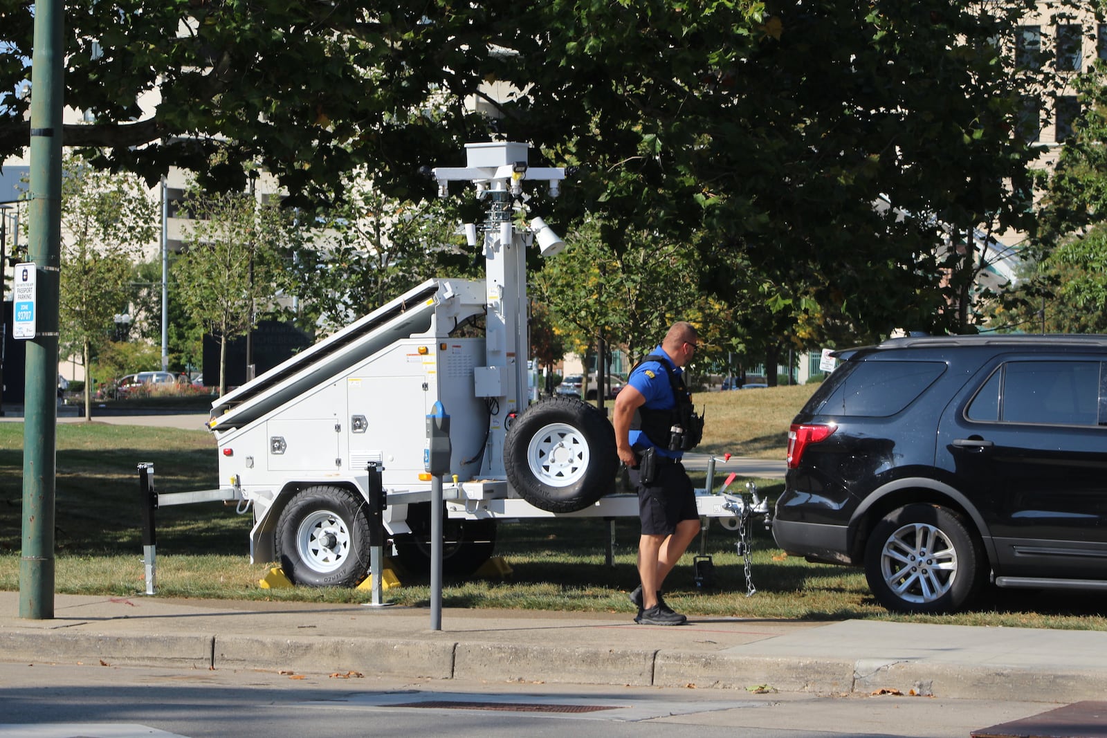 Dayton police officials on Wednesday, Sept. 20, 2023, installed a mobile crime unit trailer on South Jefferson Street by the Levitt Pavilion Dayton that has security cameras. The trailer was placed there one day after two people were shot in the area, along the 100 block of South Jefferson Street. CORNELIUS FROLIK / STAFF