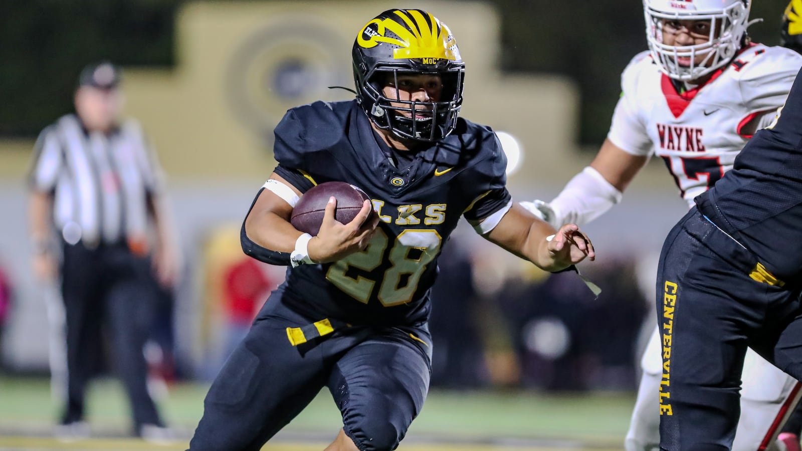 Centerville High School junior Parker Johnson runs the ball during their game against Wayne on Friday night at Centerville Stadium. Johnson scored three TDs as the Elks won 38-14. CONTRIBUTED PHOTO BY MICHAEL COOPER