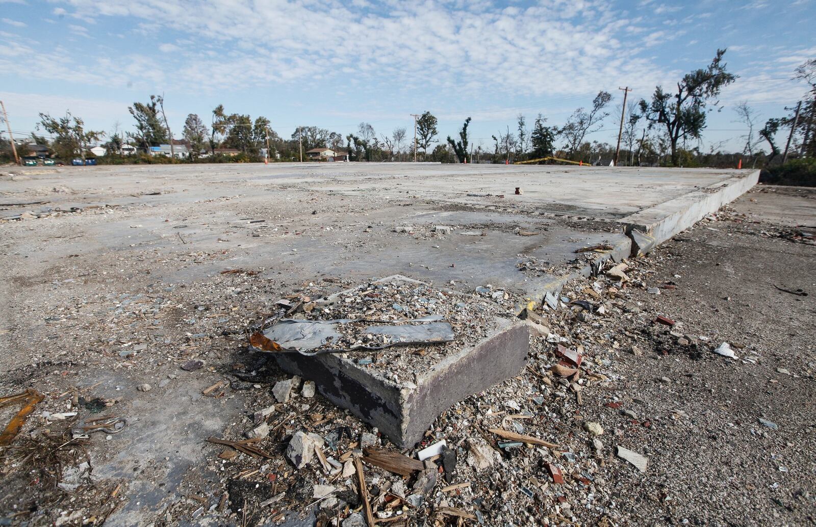 A foundation was all that remained of The Living Room after the rest of the strip club and several other damaged businesses nearby including a Family Dollar, a Little Caesar’s Pizza and Pandora Beauty Supply were razed in recent weeks. CHRIS STEWART / STAFF