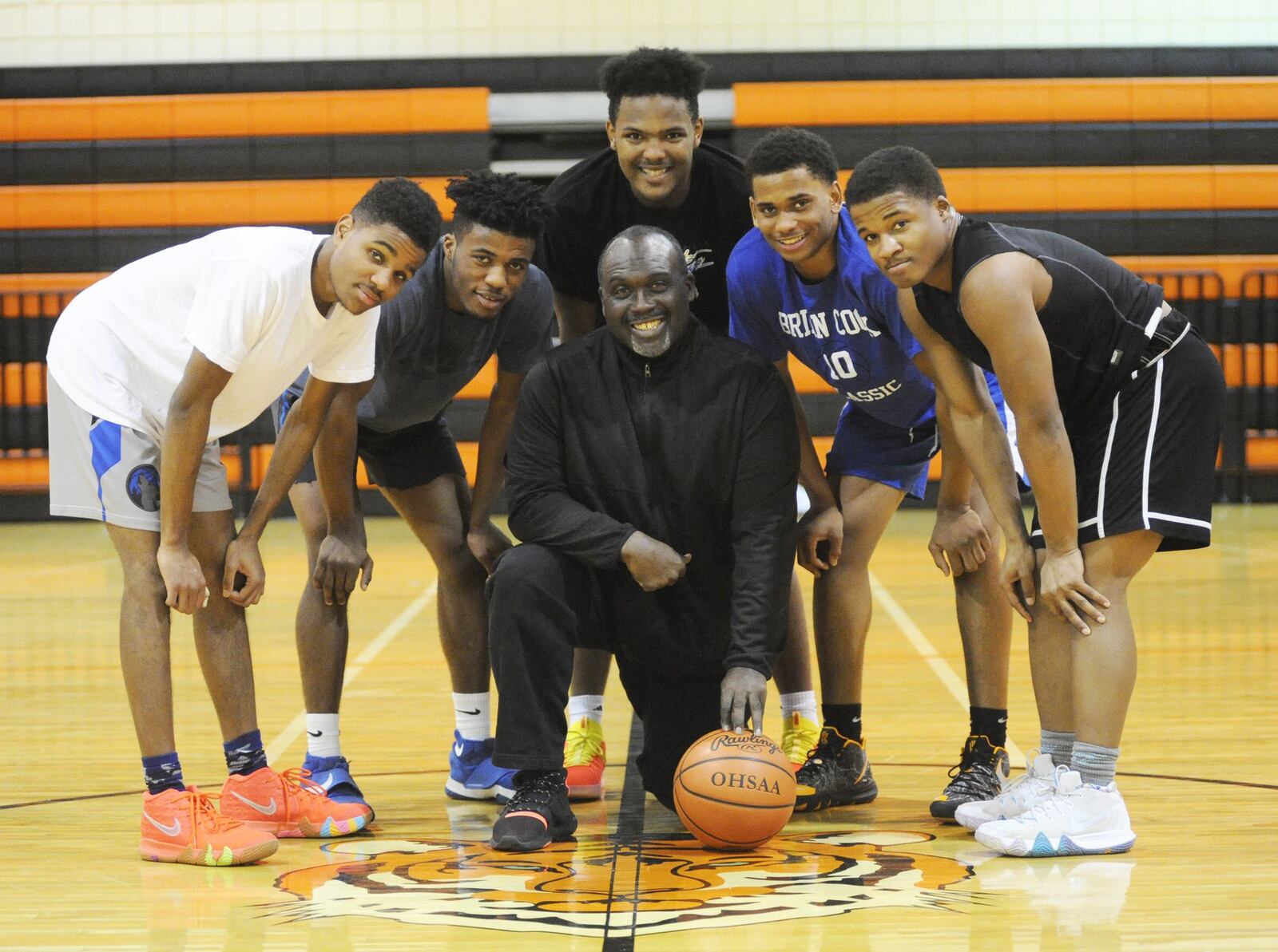 The Stivers High School boys basketball team has rallied around coach Felix Turner (Center). Taking a break from practice are Tigers starters Allen Lattimore (left), Da’juan Allen, Lorenzo Lewis, Trevon Ellis and Doug Spear on Wednesday, Jan. 2, 2019. MARC PENDLETON / STAFF