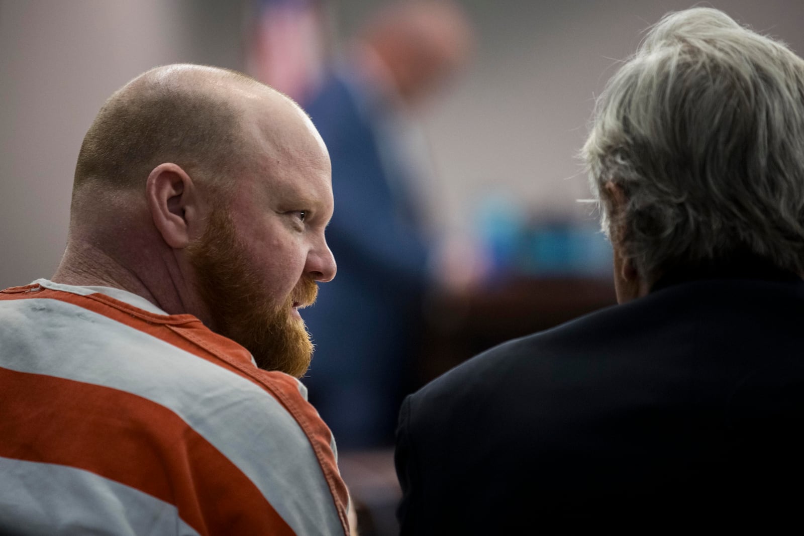 Travis McMichael speaks with his attorney during a hearing challenging his conviction of killing Ahmaud Arbery in 2020, Thursday, Oct. 24, 2024, in Brunswick, Ga. (AP Photo/Stephen B. Morton)