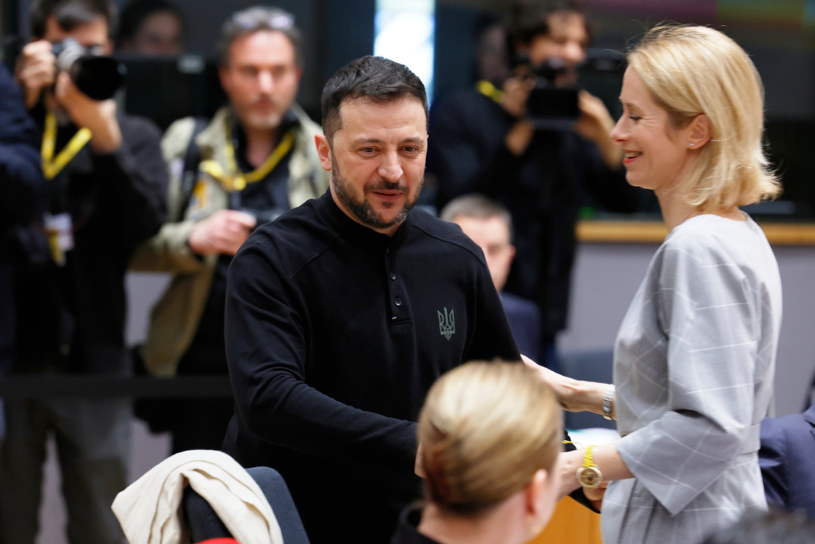 Ukraine's President Volodymyr Zelenskyy, center, speaks with European Union foreign policy chief Kaja Kallas, right, during a round table meeting at an EU Summit in Brussels, Thursday, March 6, 2025. (AP Photo/Geert Vanden Wijngaert)