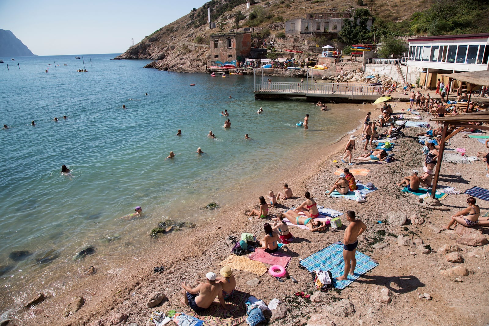 FILE - People gather at a beach in Balaklava Bay, part of Sevastopol on the Crimean Peninsula, Aug. 9, 2015. (AP Photo, File)