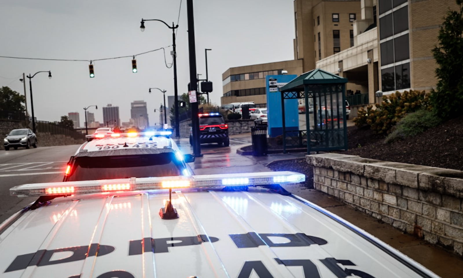 Dayton police cruisers line up in front of Miami Valley Hospital after a police recruit was seriously injured Thursday, Oct. 5, 2023, when a pickup truck crashed into a cruiser during a training exercise on state Route 4. A Dayton police supervisor and two other recruits also were injured in the crash. JIM NOELKER/STAFF