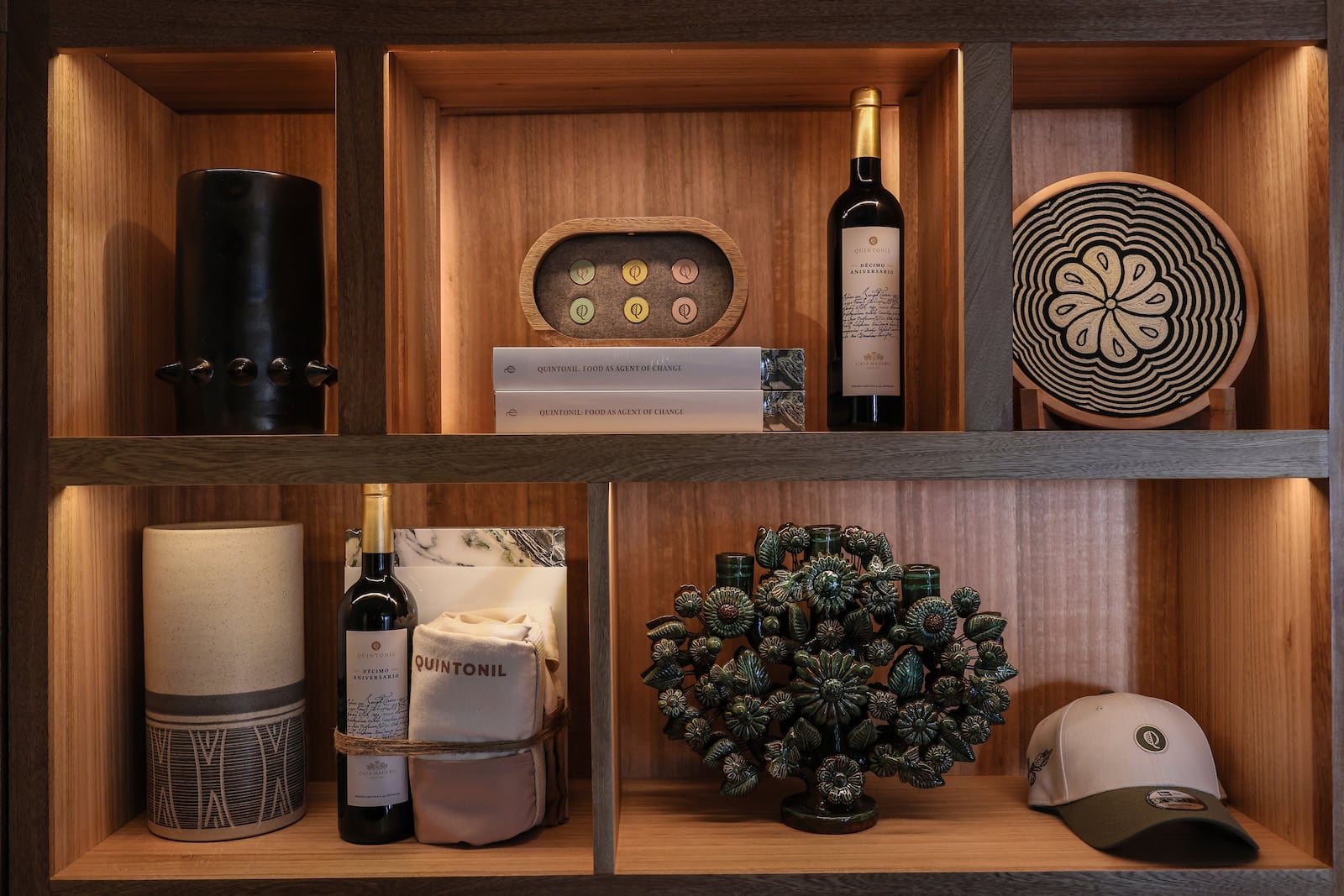 Quintonil merchandise sits for sale on a shelf at the restaurant in Mexico City, Friday, Feb. 28, 2025. (AP Photo/Ginnette Riquelme)