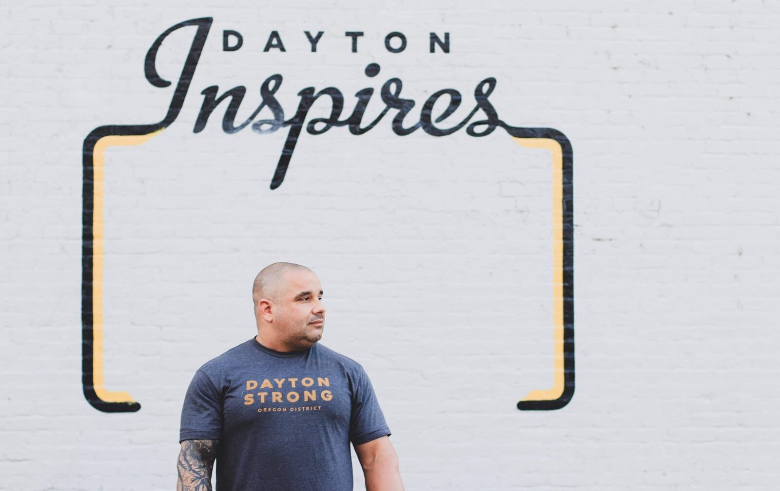 Jeremy Ganger in the Oregon District in front of the 'Dayton Inspires' sign. Contributed photo.