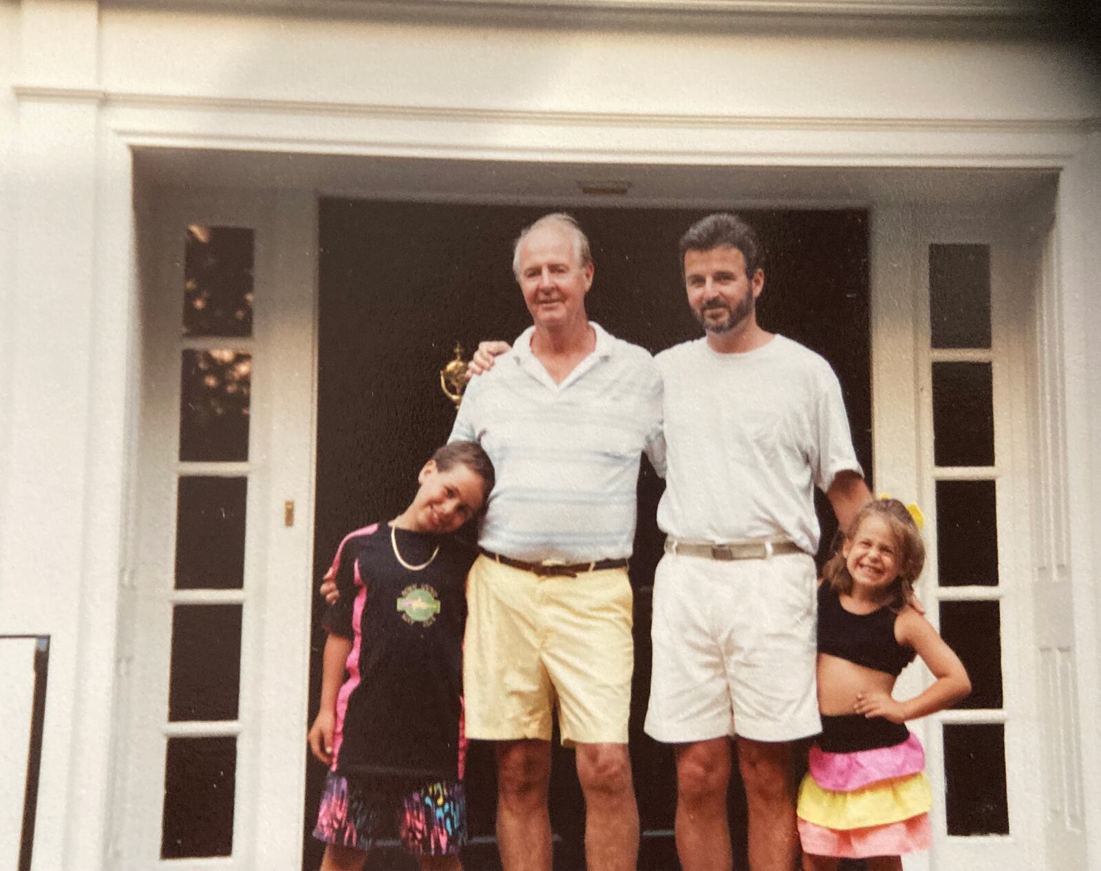 Gregor Pratt, second from right), with his children Justin and Lauren and his father Loran Pratt in front of their Middletown home. CONTRIBUTED