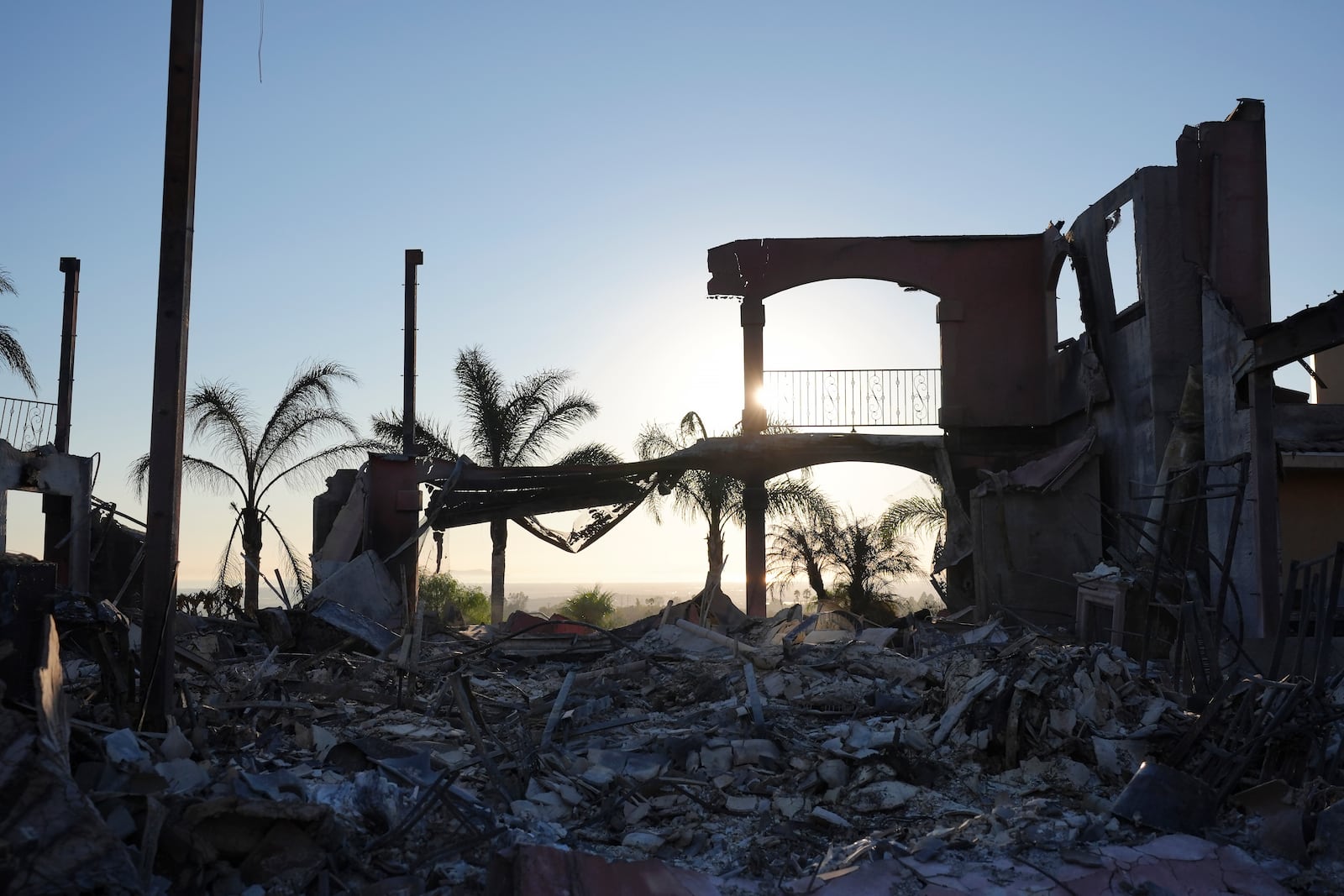 The remains of a home destroyed by the Mountain Fire is shown in Camarillo, Calif., Friday, Nov. 8, 2024. (AP Photo/Jae C. Hong)