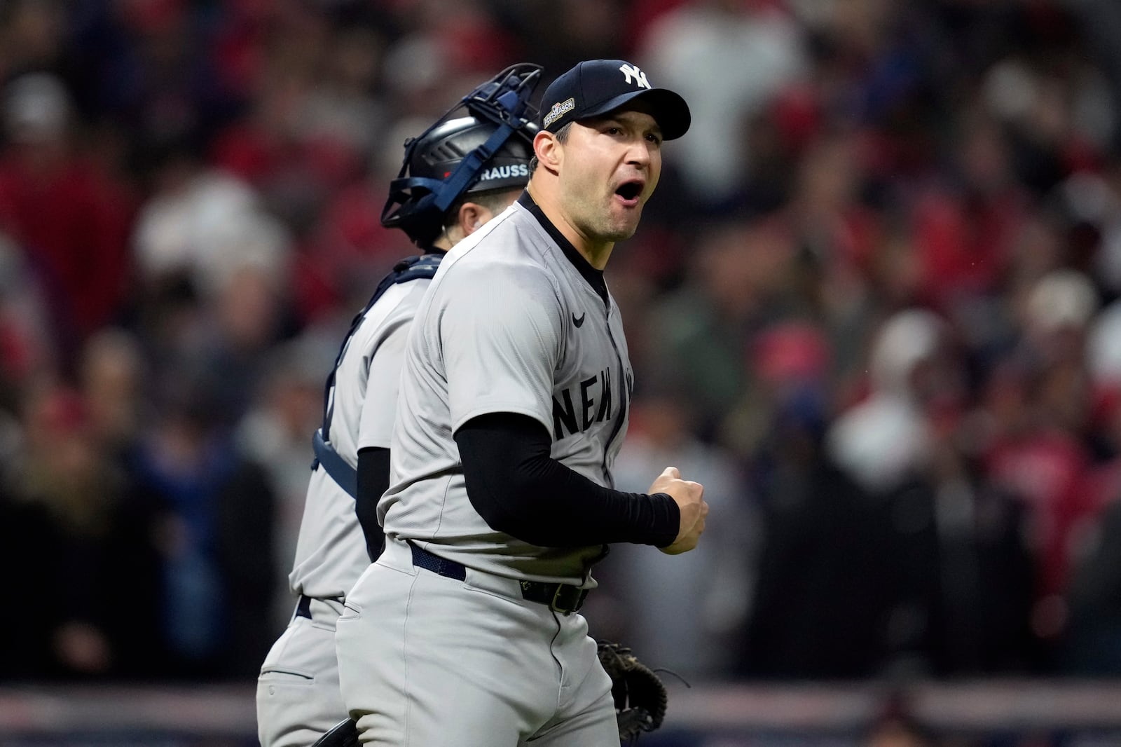 New York Yankees pitcher Tommy Kahnle celebrates after Game 4 of the baseball AL Championship Series against the Cleveland Guardians Friday, Oct. 18, 2024, in Cleveland. The Yankees won 8-6 to take a 3-1 lead in the best-of-seven series. (AP Photo/Godofredo A. Vásquez)