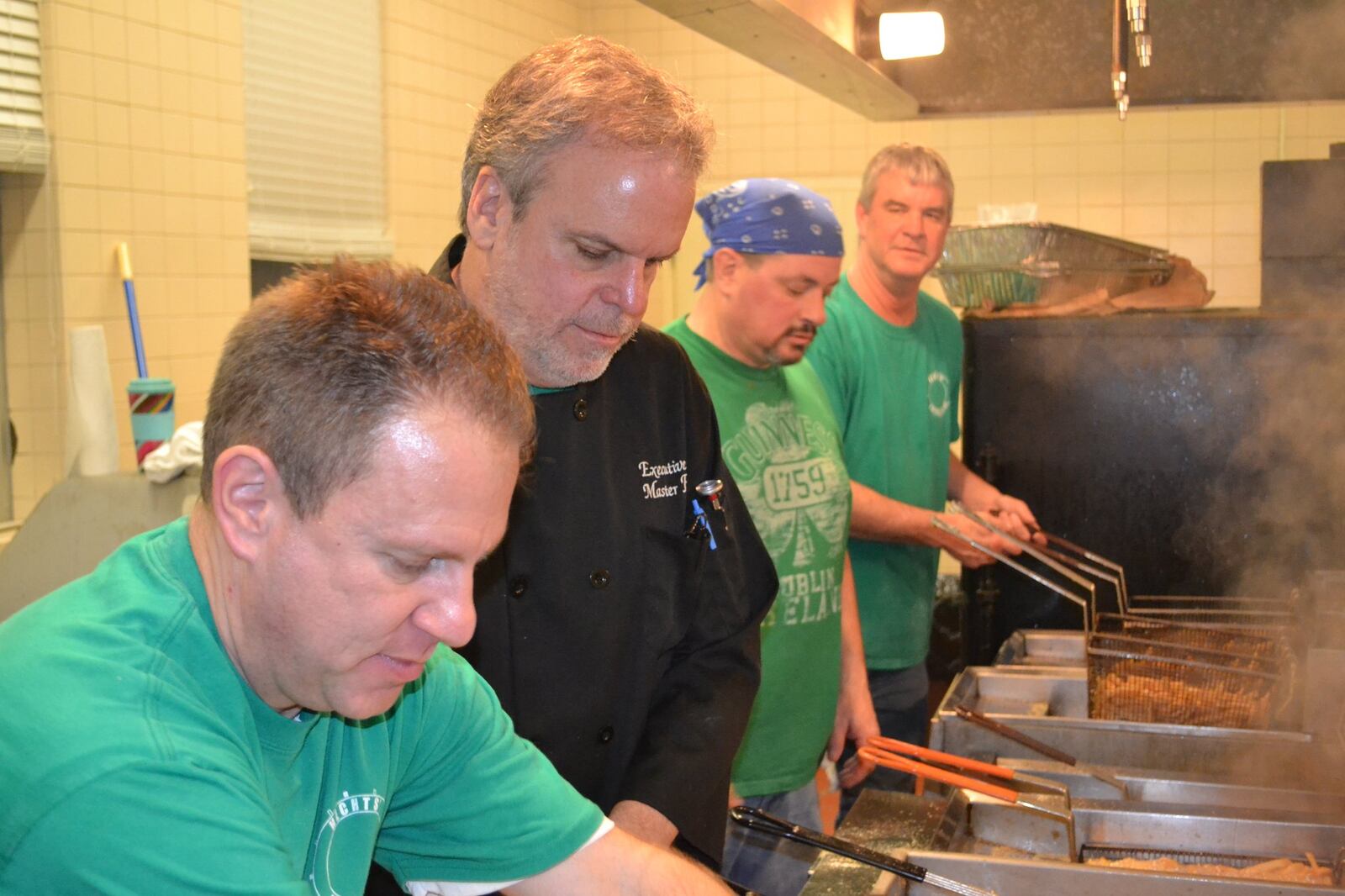 Jeff Hecht (from left), Paul Westhafer, Todd Post and Ted Hecht fry fish at the Alter Fish Fry in Kettering on Feb. 23. CONTRIBUTED