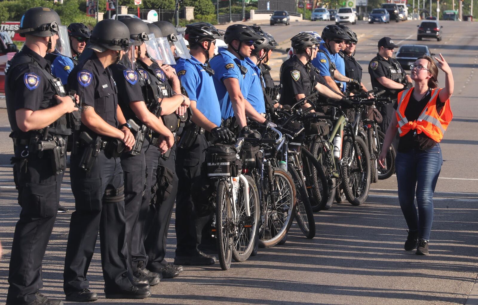 The organizer of the Huber Heights protest try to get the police to leave and stop a potential confrontation. BILL LACKEY\STAFF