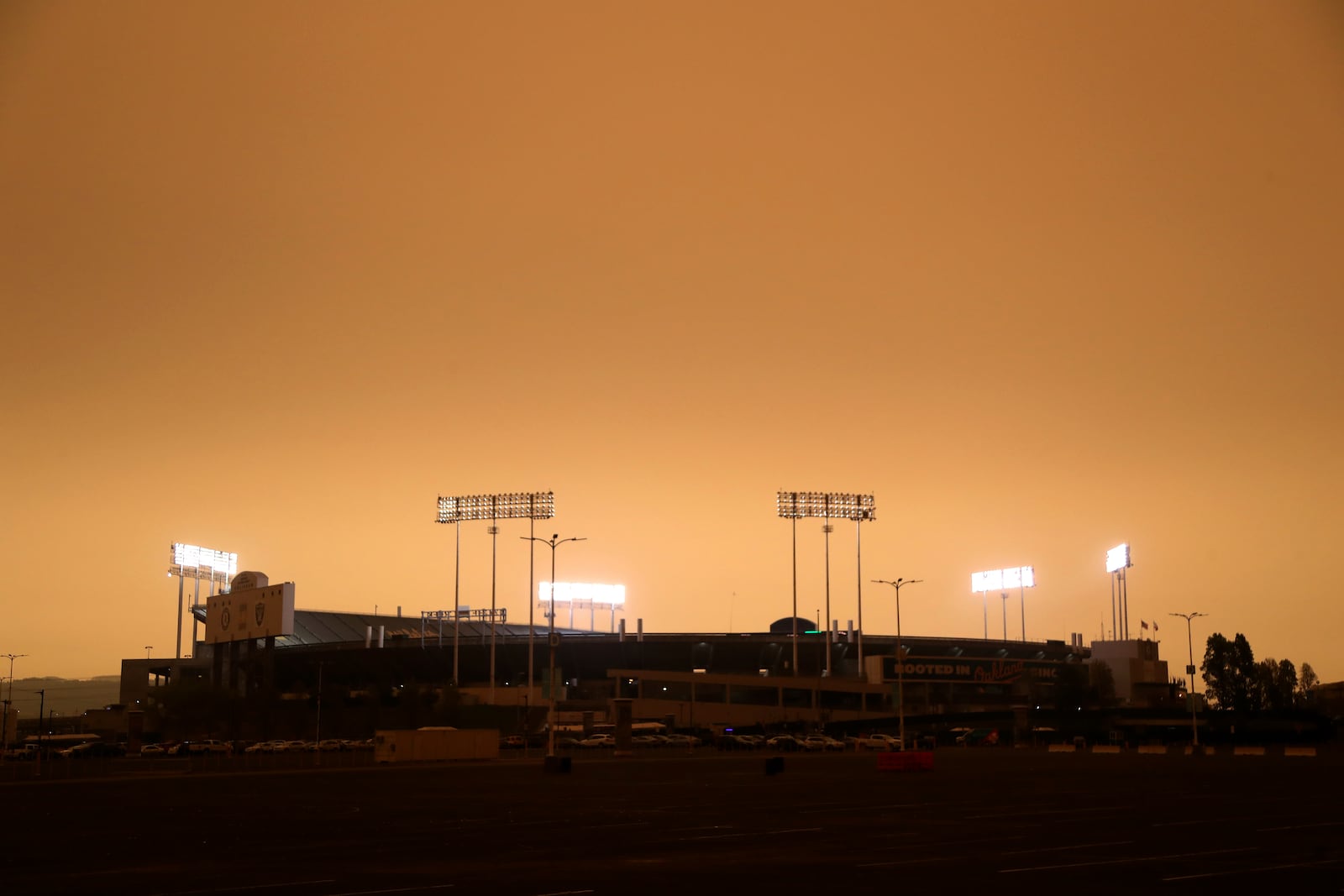 RingCentral Coliseum stands under skies darkened by wildfire smoke before the Oakland Athletics' baseball game against the Houston Astros in Oakland, Calif., Wednesday, Sept. 9, 2020. (AP Photo/Jed Jacobsohn)