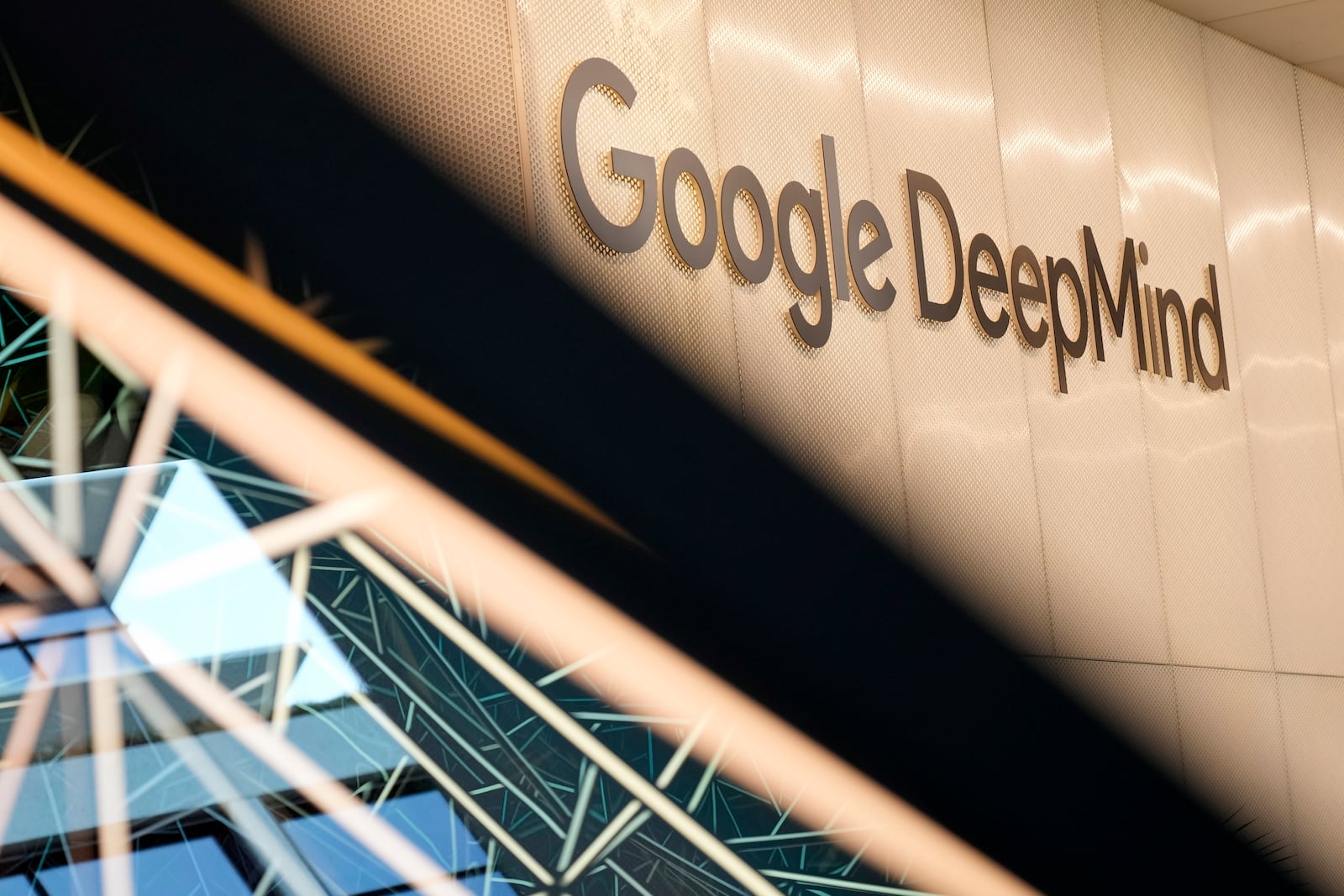 View at the Google DeepMind logo at the office building in London, Wednesday, Oct. 9, 2024. Demis Hassabis and John Jumper were awarded the Nobel Prize in chemistry for their breakthrough work predicting and designing the structure of proteins, the building blocks of life. Hassabis and Jumper both work at Google Deepmind in London. (AP Photo/Alastair Grant)