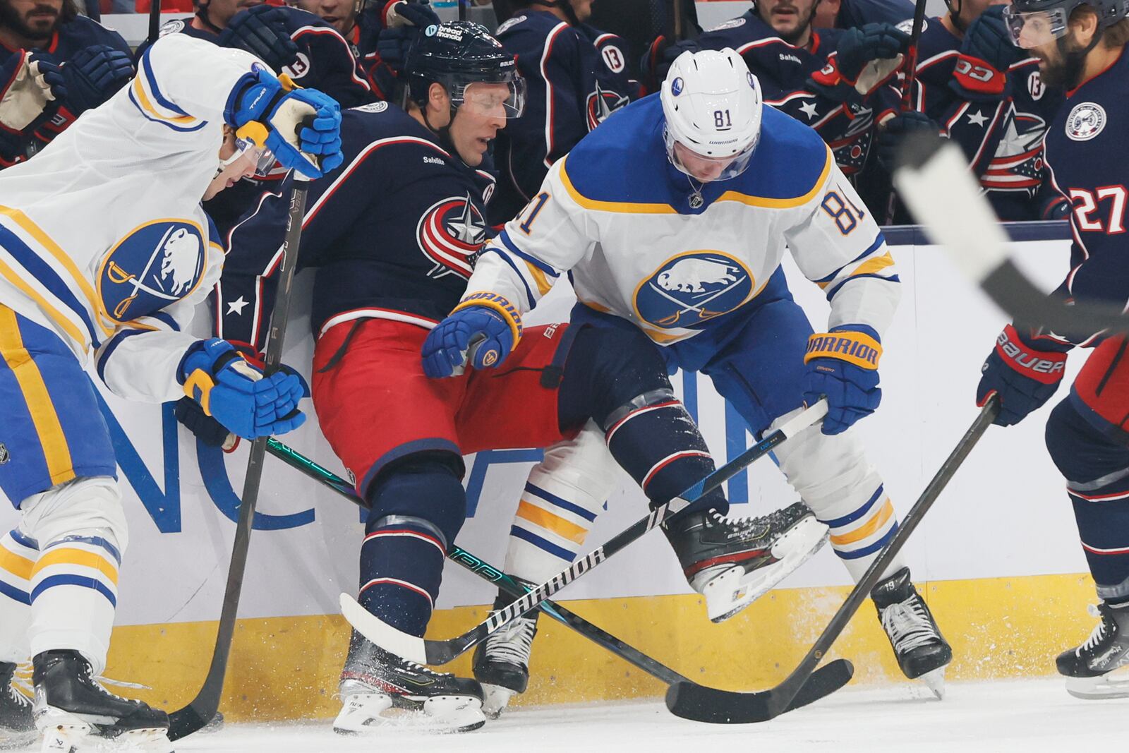 Columbus Blue Jackets' Jack Johnson, left, and Buffalo Sabres' Sam Lafferty fight for the puck during the first period of an NHL hockey game Thursday, Oct. 17, 2024, in Columbus, Ohio. (AP Photo/Jay LaPrete)