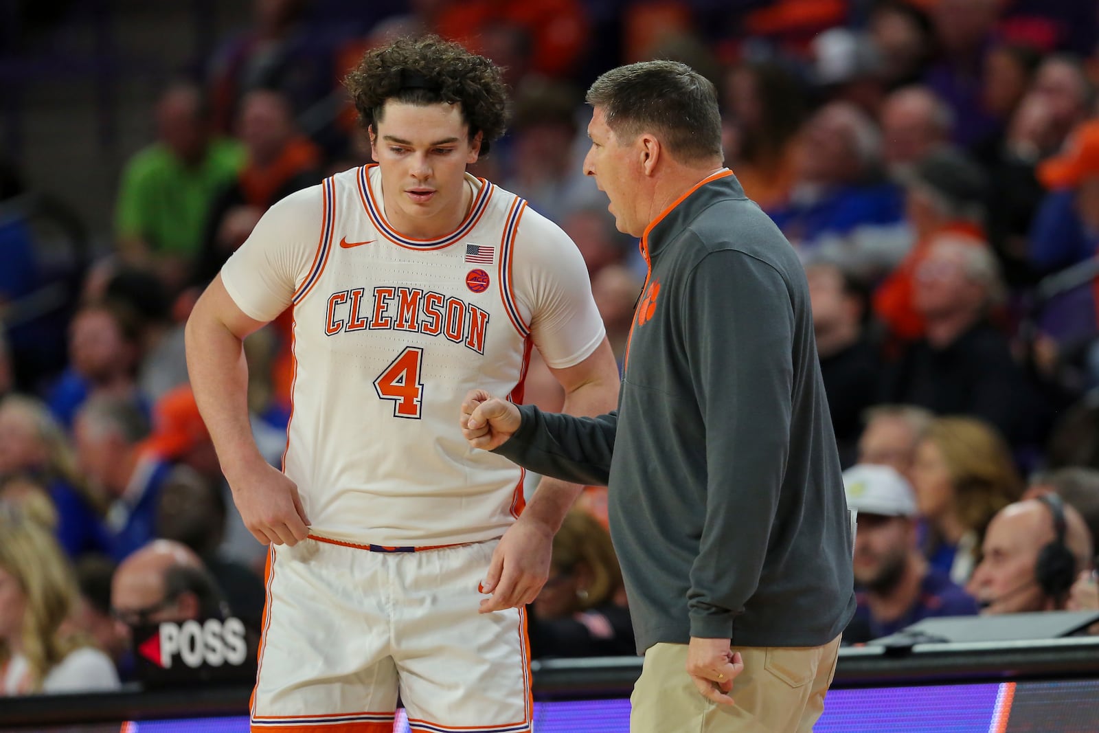 Clemson head coach Brad Brownell talks to forward Ian Schieffelin (4) during the first half of an NCAA college basketball game against Kentucky, Tuesday, Dec. 3, 2024, in Clemson, S.C. (AP Photo/Artie Walker Jr.)