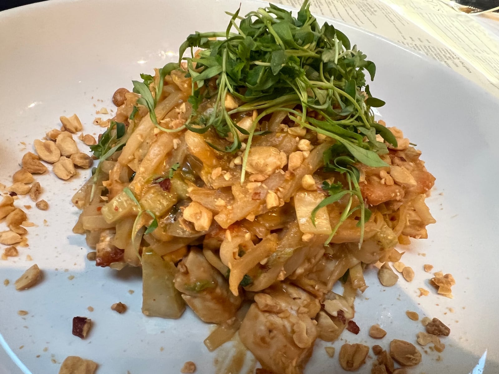 Coco's Bistro Thai peanut dish with rice noodles, peanut sauce, onion, napa cabbage, chopped peanuts and cilantro ($24)