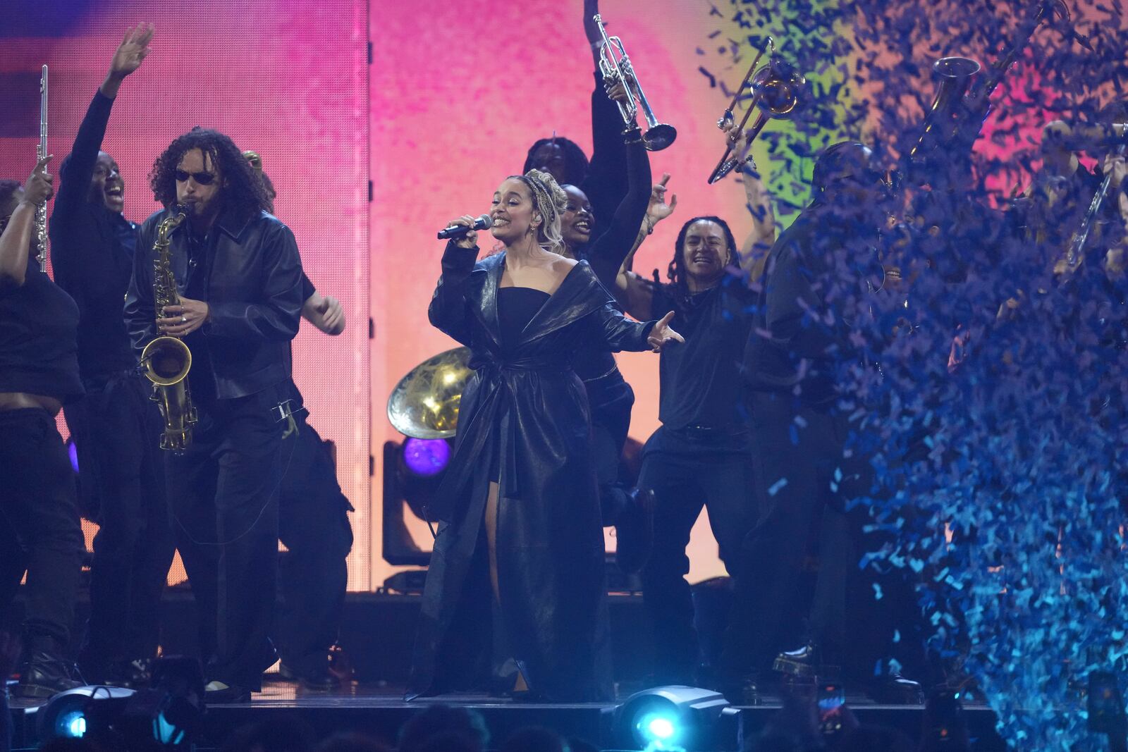 Jorja Smith, centre, and Ezra Collective perform during the Brit Awards 2025 in London, Saturday, March.1, 2025. (Photo by Scott A Garfitt/Invision/AP)