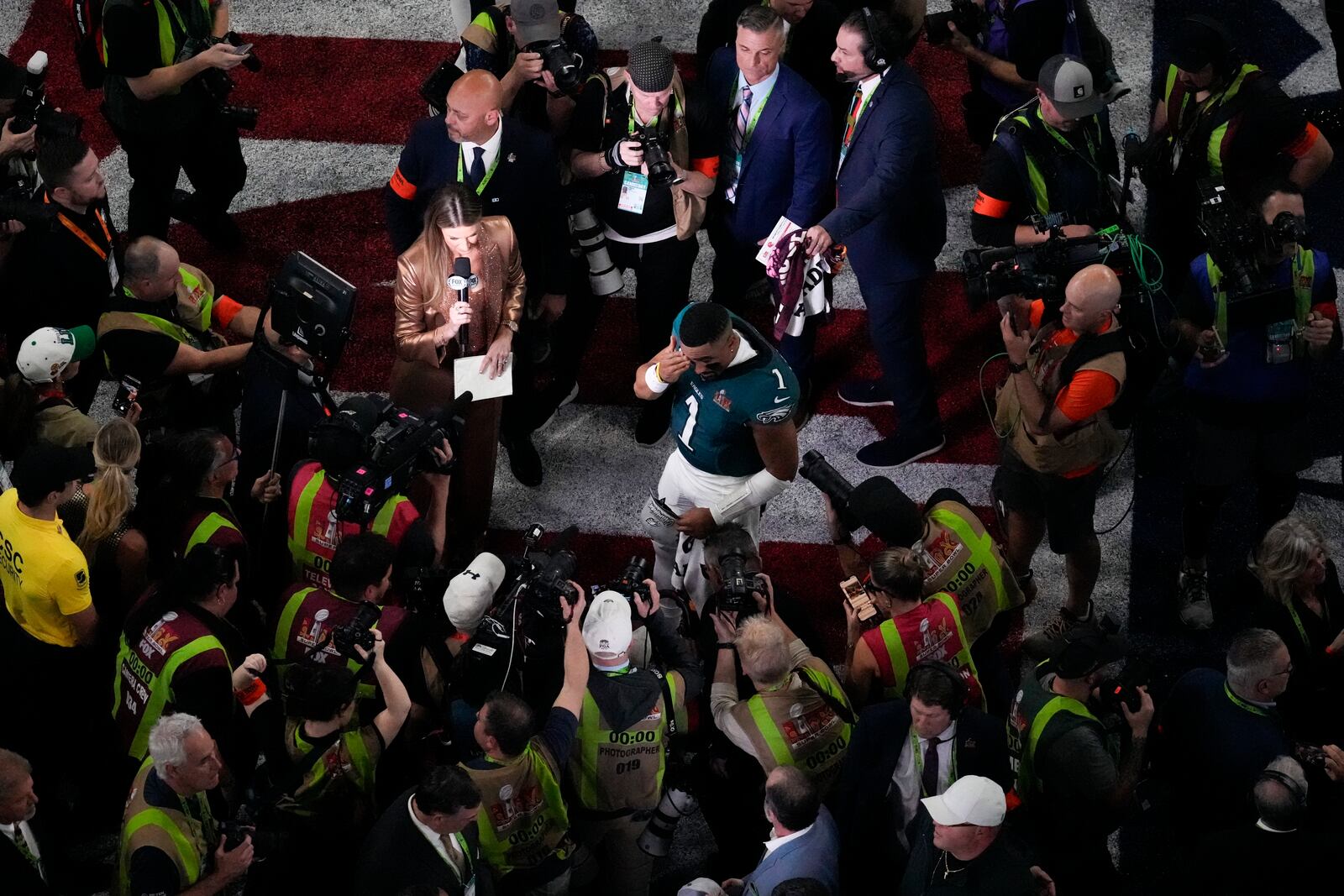 Philadelphia Eagles quarterback Jalen Hurts (1) wipes his eyes after the NFL Super Bowl 59 football game against the Kansas City Chiefs, Sunday, Feb. 9, 2025, in New Orleans. (AP Photo/David J. Phillip)