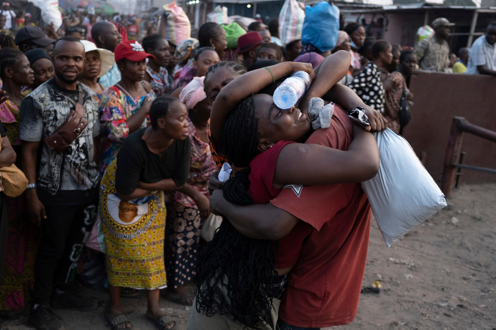 Relatives greet some of the 600 prisoners released from Democratic Republic of the Congo's capital Kinshasa's Makala Central Prison, Saturday, Sept. 21, 2024. (AP Photo/Samy Ntumba Shambuyi)