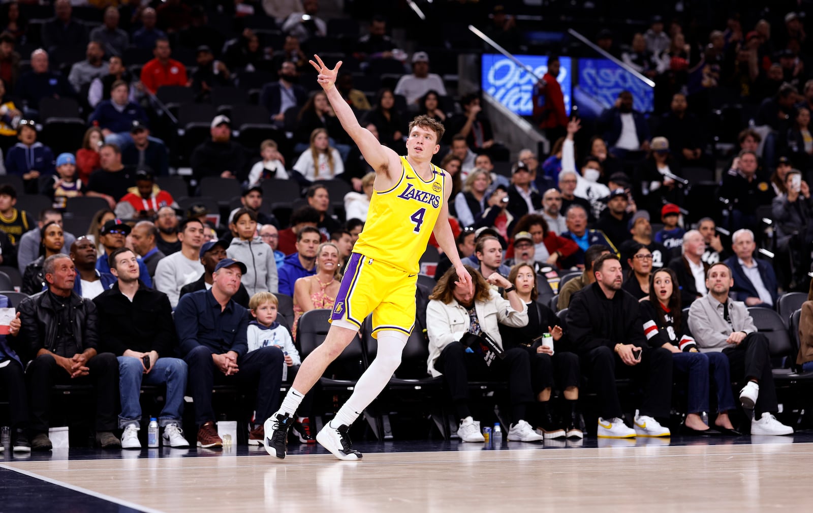 Los Angeles Lakers guard Dalton Knecht celebrates after scoring a three-point basket against the Los Angeles Clippers during the first half of an NBA basketball game Tuesday, Feb. 4, 2025, in Los Angeles. (AP Photo/Kevork Djansezian)